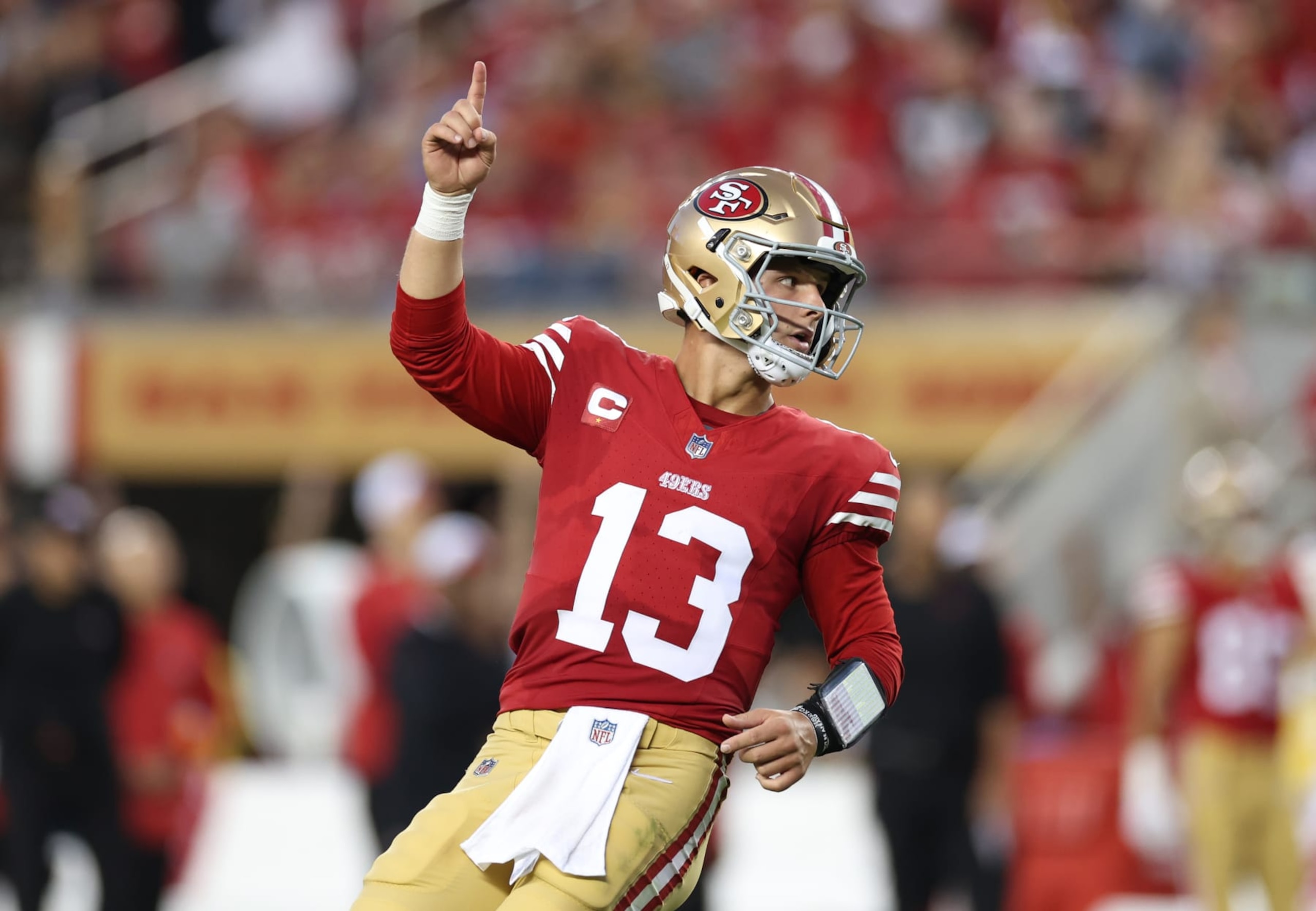 SANTA CLARA, CALIFORNIA - OCTOBER 08: Brock Purdy #13 of the San Francisco 49ers reacts after a touchdown by Christian McCaffrey #23 during the second quarter against the Dallas Cowboys at Levi's Stadium on October 08, 2023 in Santa Clara, California. (Photo by Ezra Shaw/Getty Images)