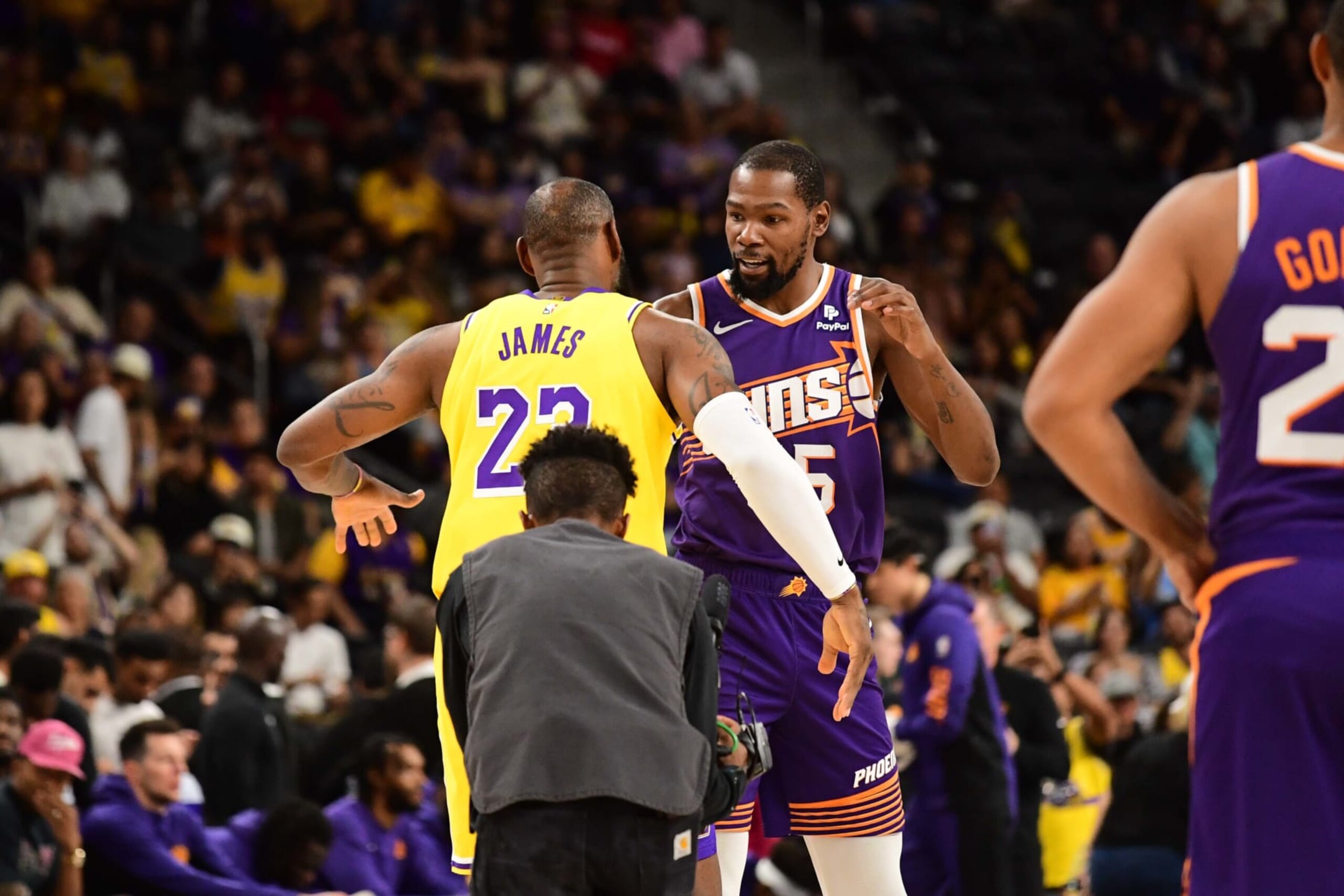 PALM SPRINGS, CA - OCTOBER 19: LeBron James #23 of the Los Angeles Lakers and Kevin Durant #35 of the Phoenix Suns embrace before the game on October 19, 2023 at the Acrisure Arena in Palm Springs, California. NOTE TO USER: User expressly acknowledges and agrees that, by downloading and/or using this Photograph, user is consenting to the terms and conditions of the Getty Images License Agreement. Mandatory Copyright Notice: Copyright 2023 NBAE (Photo by Adam Pantozzi/NBAE via Getty Images)