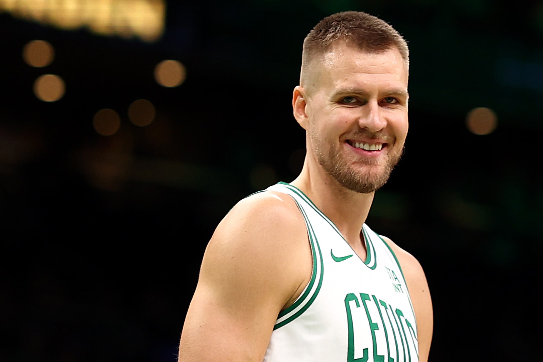 BOSTON, MASSACHUSETTS - OCTOBER 17: Kristaps Porzingis #8 of the Boston Celtics looks on during the first quarter of the Celtic's preseason game against the New York Knicks at TD Garden on October 17, 2023 in Boston, Massachusetts. NOTE TO USER: User expressly acknowledges and agrees that, by downloading and or using this photograph, User is consenting to the terms and conditions of the Getty Images License Agreement. (Photo by Maddie Meyer/Getty Images)