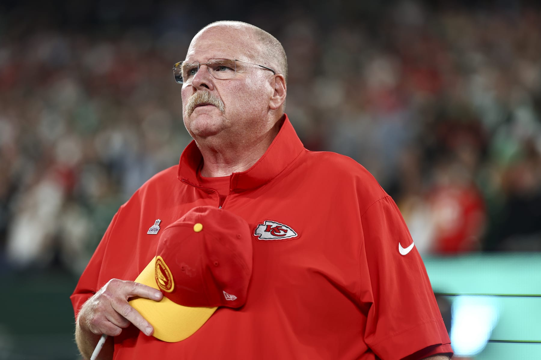 EAST RUTHERFORD, NJ - OCTOBER 1: Head coach Andy Reid of the Kansas City Chiefs stands on the sidelines during the national anthem prior to an NFL football game against the New York Jets at MetLife Stadium on October 1, 2023 in East Rutherford, New Jersey. (Photo by Kevin Sabitus/Getty Images)