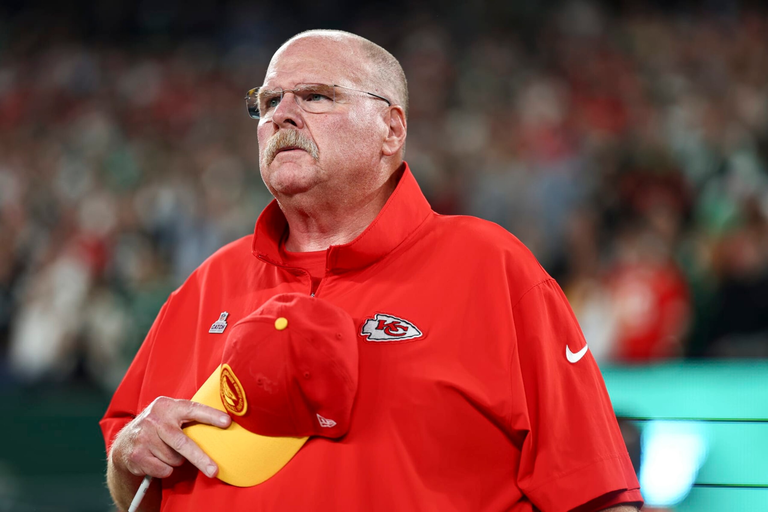 EAST RUTHERFORD, NJ - OCTOBER 1: Head coach Andy Reid of the Kansas City Chiefs stands on the sidelines during the national anthem prior to an NFL football game against the New York Jets at MetLife Stadium on October 1, 2023 in East Rutherford, New Jersey. (Photo by Kevin Sabitus/Getty Images)