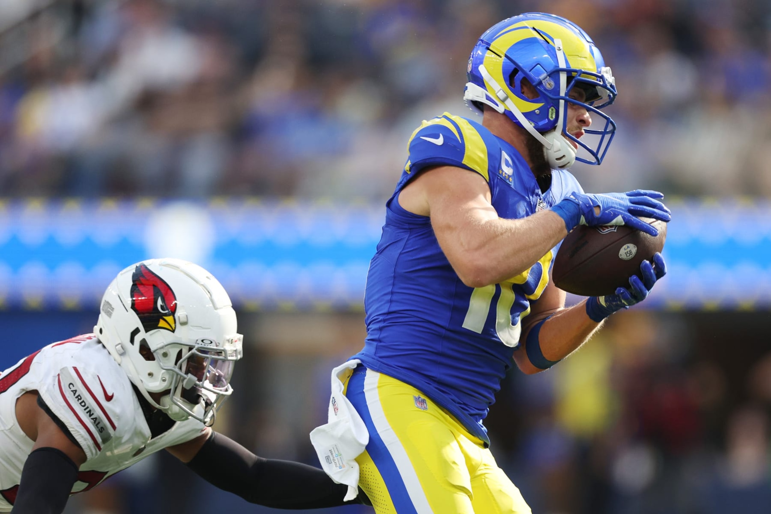 INGLEWOOD, CALIFORNIA - OCTOBER 15: Cooper Kupp #10 of the Los Angeles Rams catches a ball against Marco Wilson #20 of the Arizona Cardinals during the fourth quarter at SoFi Stadium on October 15, 2023 in Inglewood, California. (Photo by Harry How/Getty Images)