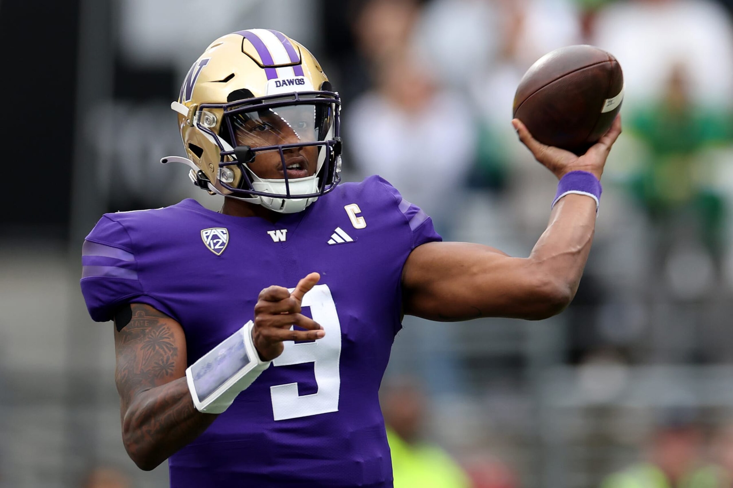 SEATTLE, WASHINGTON - OCTOBER 14: Michael Penix Jr. #9 of the Washington Huskies passes against the Oregon Ducks during the third quarter at Husky Stadium on October 14, 2023 in Seattle, Washington. (Photo by Steph Chambers/Getty Images)