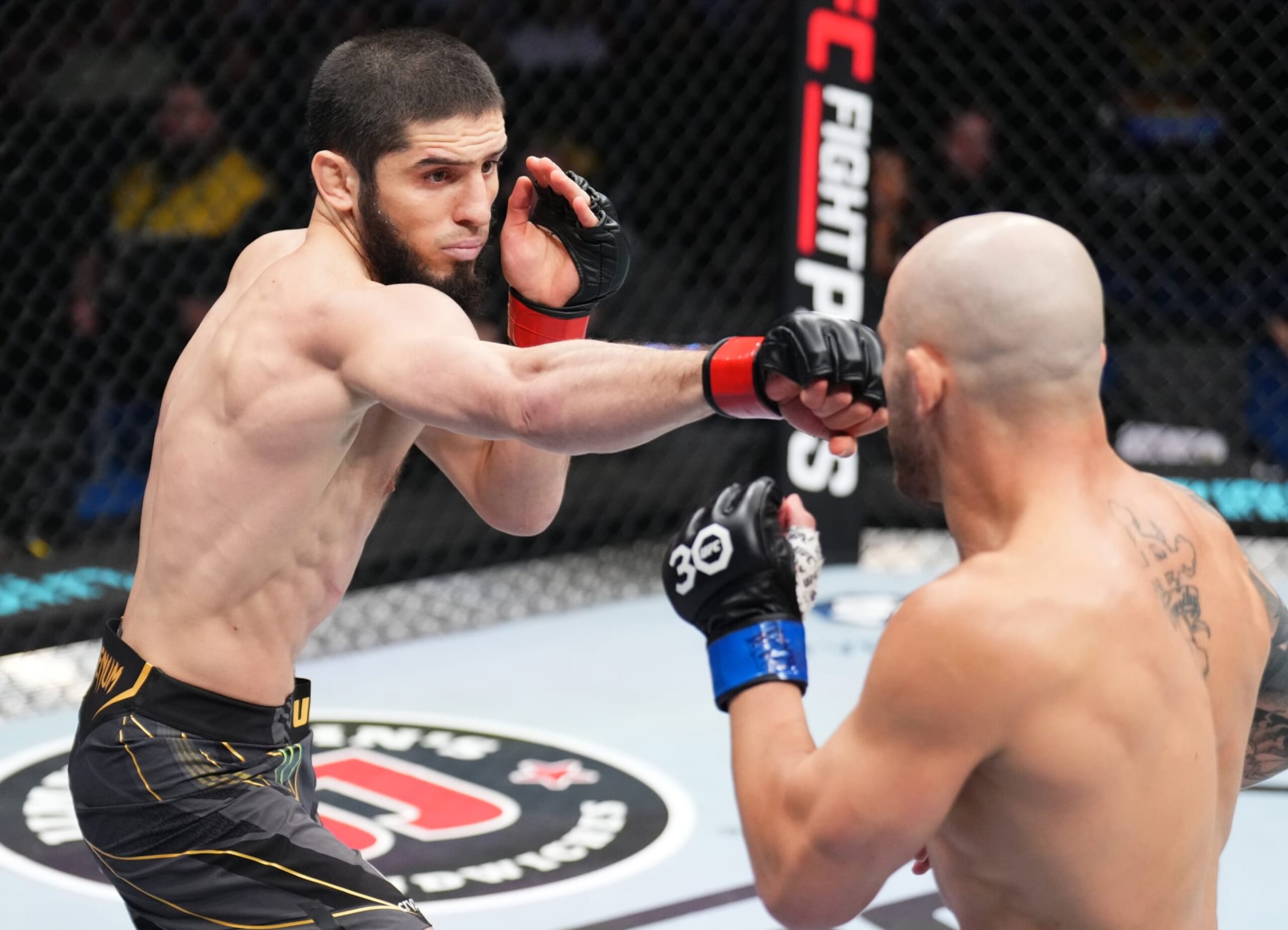 PERTH, AUSTRALIA - FEBRUARY 12: (L-R) Islam Makhachev of Russia punches Alexander Volkanovski of Australia in the UFC lightweight championship fight during the UFC 284 event at RAC Arena on February 12, 2023 in Perth, Australia. (Photo by Chris Unger/Zuffa LLC via Getty Images) PERTH, AUSTRALIA - FEBRUARY 12: (L-R) Islam Makhachev of Russia punches Alexander Volkanovski of Australia in the UFC lightweight championship fight during the UFC 284 event at RAC Arena on February 12, 2023 in Perth, Australia. (Photo by Chris Unger/Zuffa LLC via Getty Images)