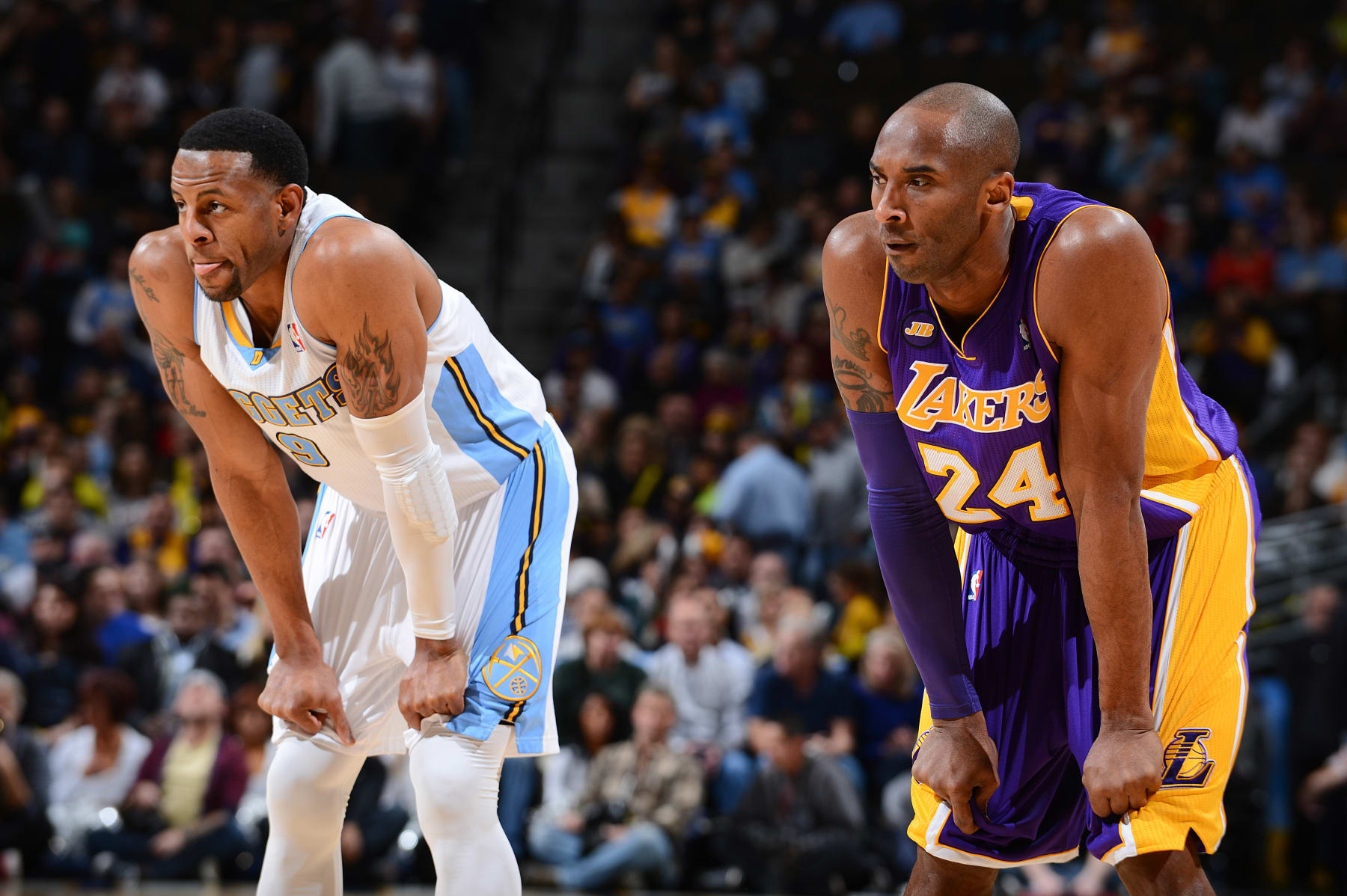 DENVER, CO - FEBRUARY 25: Kobe Bryant #24 of the Los Angeles Lakers and Andre Iguodala #9 of the Denver Nuggets wait to resume action during their game on February 25, 2013 at the Pepsi Center in Denver, Colorado. NOTE TO USER: User expressly acknowledges and agrees that, by downloading and/or using this photograph, user is consenting to the terms and conditions of the Getty Images License Agreement. Mandatory Copyright Notice: Copyright 2013 NBAE (Photo by Garrett W. Ellwood/NBAE via Getty Images)
