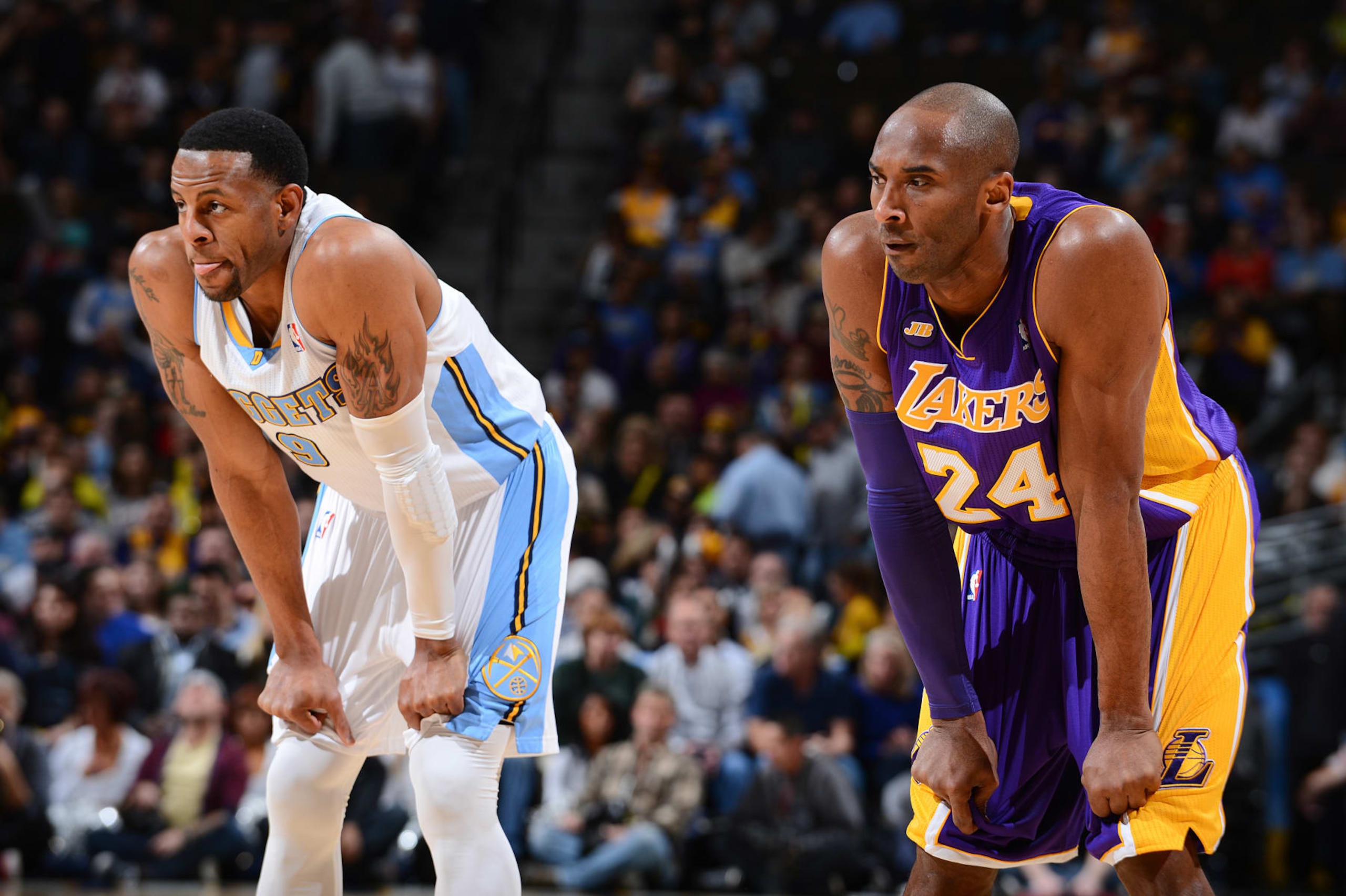 DENVER, CO - FEBRUARY 25: Kobe Bryant #24 of the Los Angeles Lakers and Andre Iguodala #9 of the Denver Nuggets wait to resume action during their game on February 25, 2013 at the Pepsi Center in Denver, Colorado. NOTE TO USER: User expressly acknowledges and agrees that, by downloading and/or using this photograph, user is consenting to the terms and conditions of the Getty Images License Agreement. Mandatory Copyright Notice: Copyright 2013 NBAE (Photo by Garrett W. Ellwood/NBAE via Getty Images)