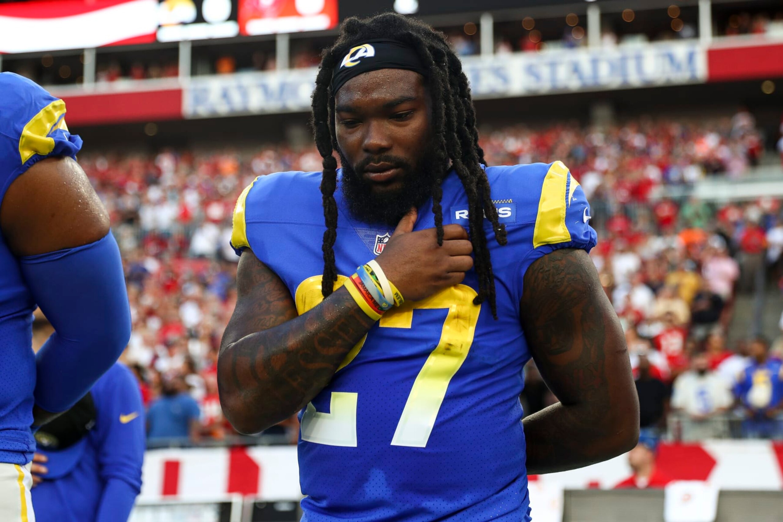 TAMPA, FL - NOVEMBER 6: Darrell Henderson Jr. #27 of the Los Angeles Rams stands during the national anthem prior to an NFL football game against the Tampa Bay Buccaneers at Raymond James Stadium on November 6, 2022 in Tampa, Florida. (Photo by Kevin Sabitus/Getty Images) TAMPA, FL - NOVEMBER 6: Darrell Henderson Jr. #27 of the Los Angeles Rams stands during the national anthem prior to an NFL football game against the Tampa Bay Buccaneers at Raymond James Stadium on November 6, 2022 in Tampa, Florida. (Photo by Kevin Sabitus/Getty Images)