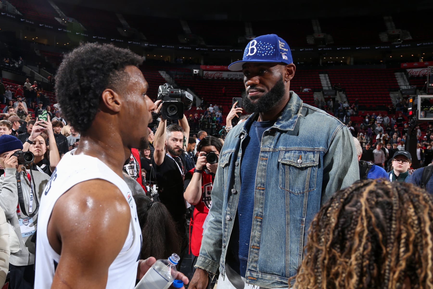 PORTLAND, OR - APRIL 8:  LeBron James talks with Bronny James #6 of Team USA during the 2023 Nike Hoop Summit on April 8, 2023 at the Moda Center Arena in Portland, Oregon. NOTE TO USER: User expressly acknowledges and agrees that, by downloading and or using this photograph, user is consenting to the terms and conditions of the Getty Images License Agreement. Mandatory Copyright Notice: Copyright 2023 NBAE (Photo by Sam Forencich/NBAE via Getty Images)