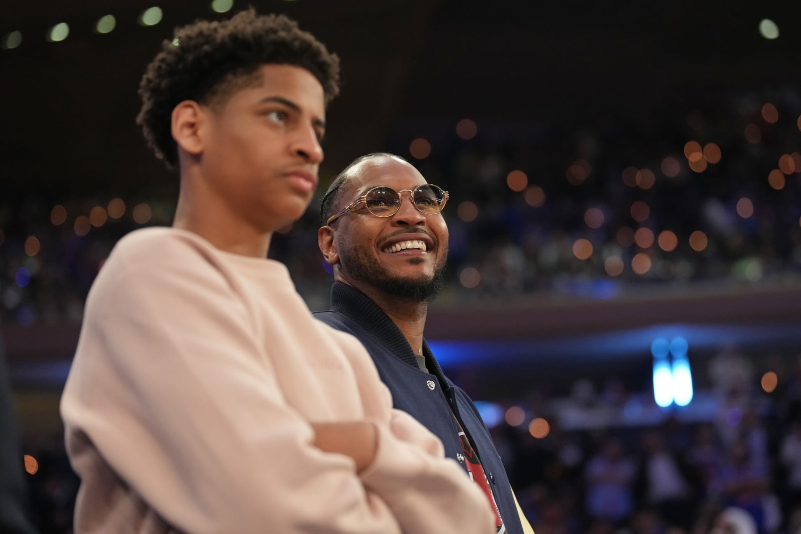NEW YORK, NY - MAY 2: Carmelo Anthony & Kiyan Anthony stands courtside during the game during Round 2 Game 2 of the 2023 NBA Playoffs on May 2, 2023 at Madison Square Garden in New York City, New York.  NOTE TO USER: User expressly acknowledges and agrees that, by downloading and or using this photograph, User is consenting to the terms and conditions of the Getty Images License Agreement. Mandatory Copyright Notice: Copyright 2023 NBAE  (Photo by Jesse D. Garrabrant/NBAE via Getty Images)