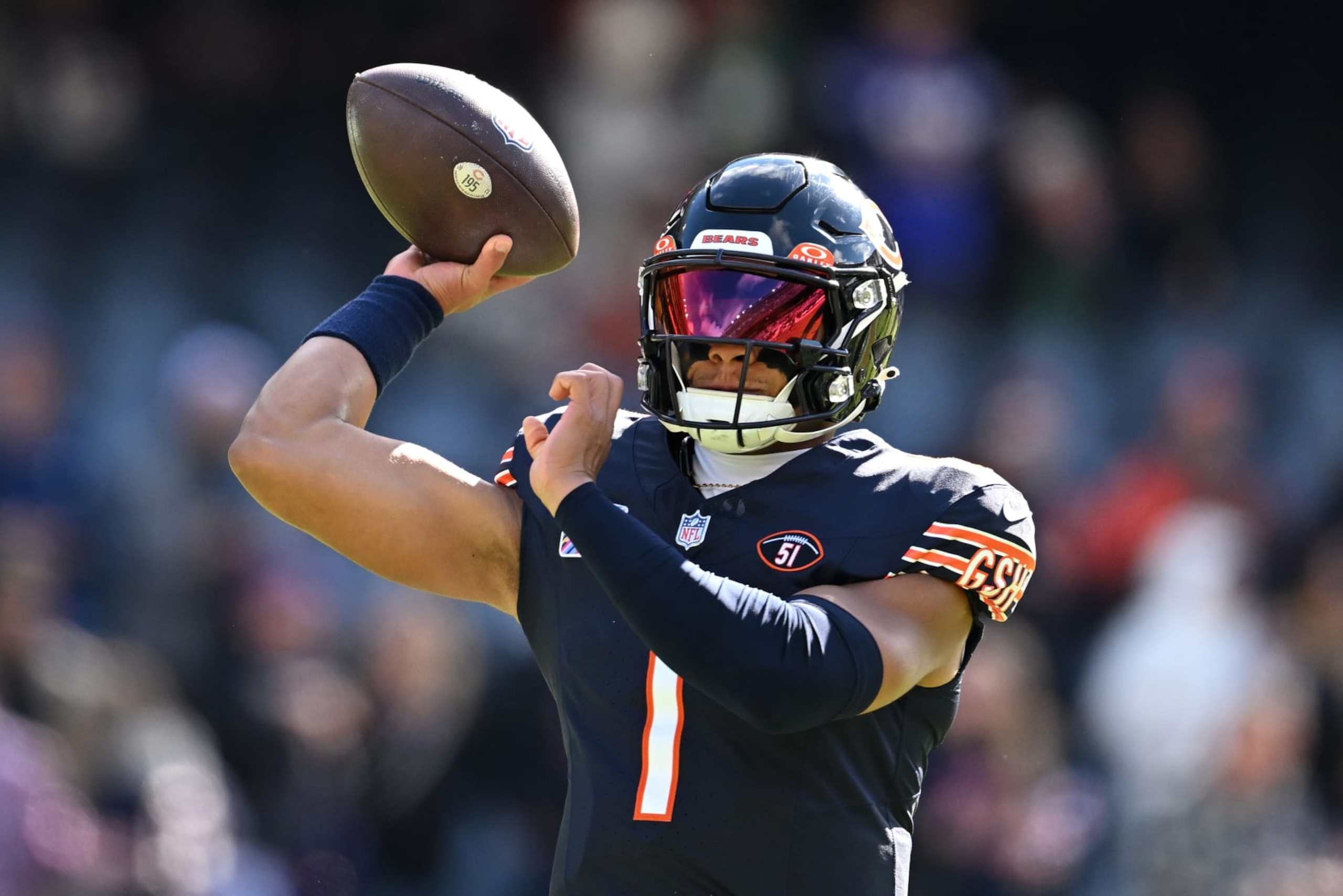 CHICAGO, ILLINOIS - OCTOBER 15: Justin Fields #1 of the Chicago Bears warms up before the game against the Minnesota Vikings at Soldier Field on October 15, 2023 in Chicago, Illinois. (Photo by Quinn Harris/Getty Images)