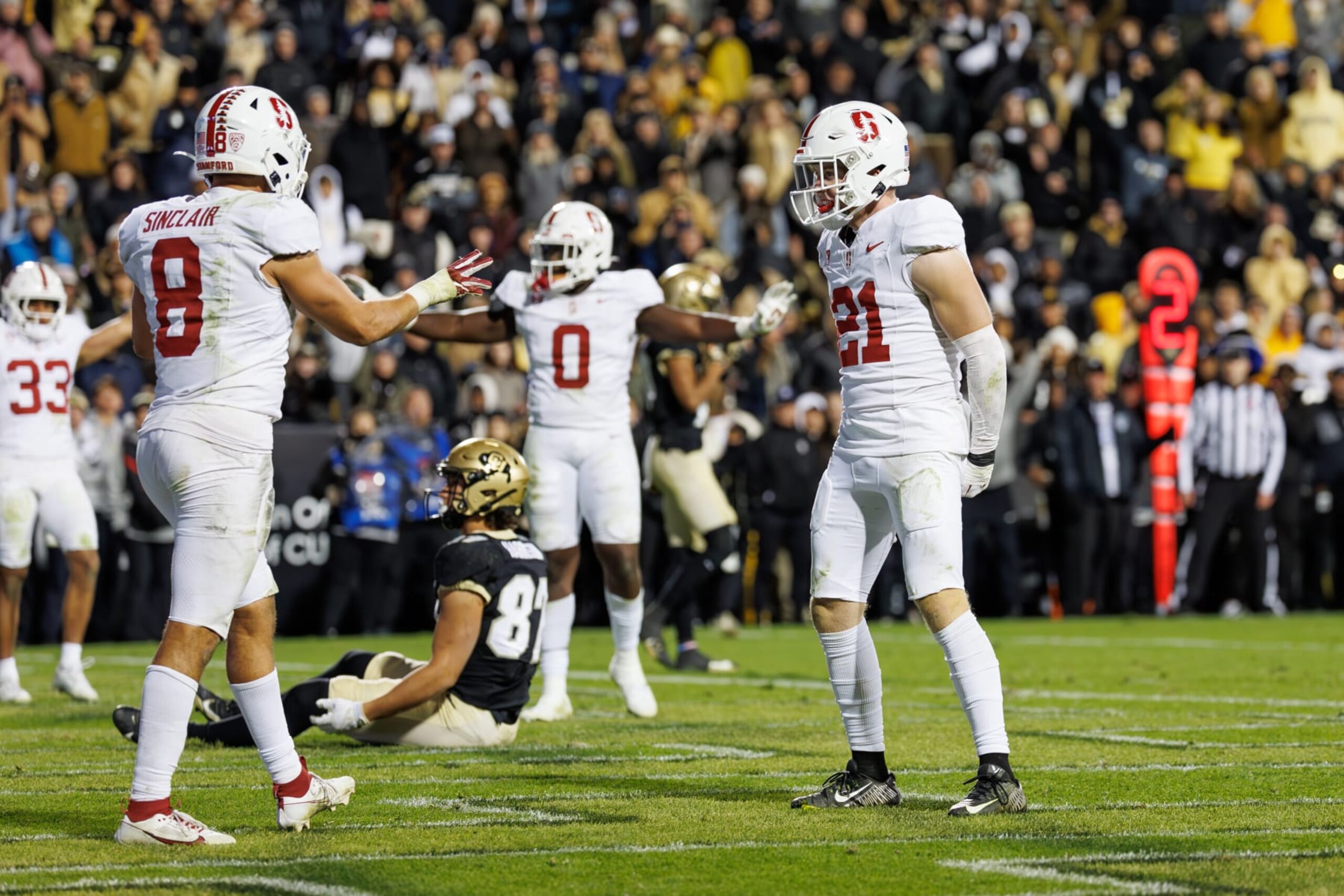 BOULDER, CO - OCTOBER 13: Scotty Edwards #21 and Tristan Sinclair #8 of the Stanford Cardinal react after an incomplete Colorado Buffaloes pass during a game between Stanford University and University of Colorado at Folsom Field on October 13, 2023 in Boulder, Colorado. (Photo by Bob Drebin/ISI Photos/Getty Images).