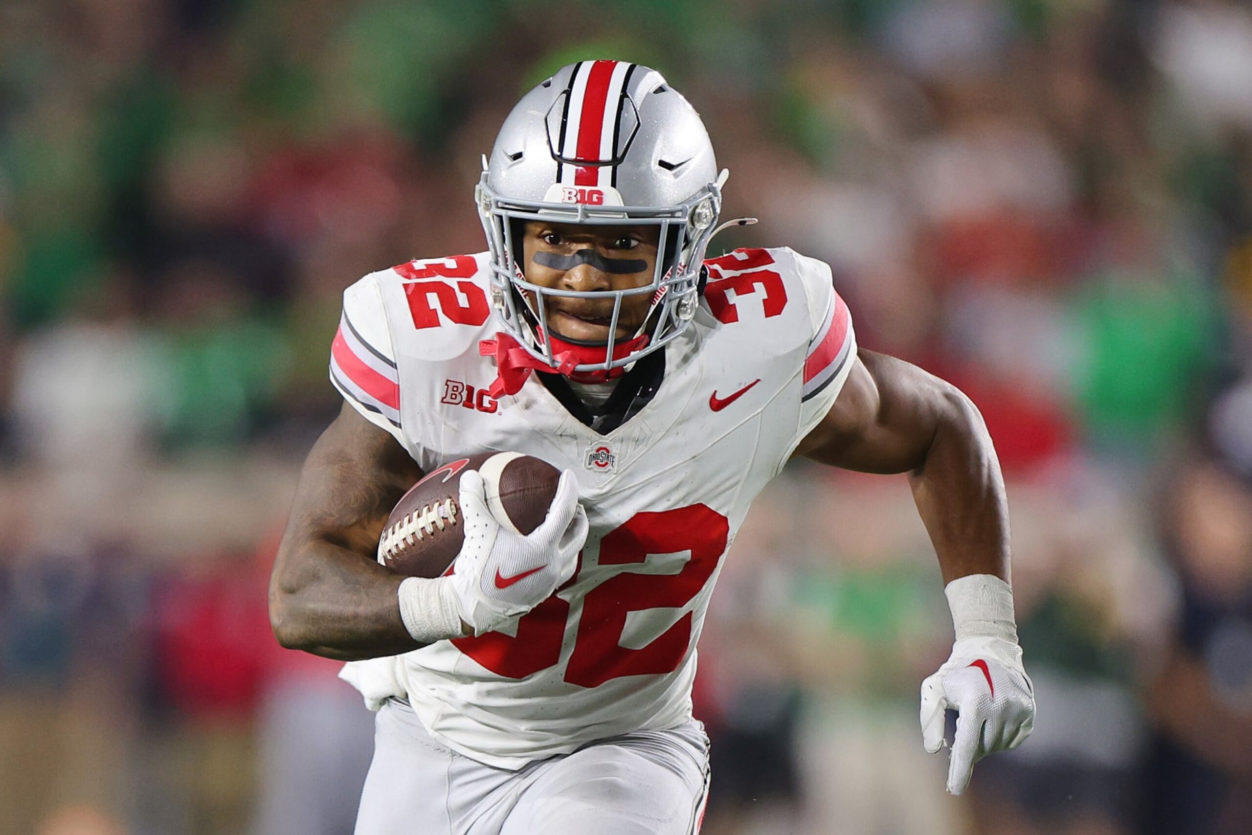SOUTH BEND, INDIANA - SEPTEMBER 23: TreVeyon Henderson #32 of the Ohio State Buckeyes runs with the ball against the Notre Dame Fighting Irish during the second half at Notre Dame Stadium on September 23, 2023 in South Bend, Indiana. (Photo by Michael Reaves/Getty Images)