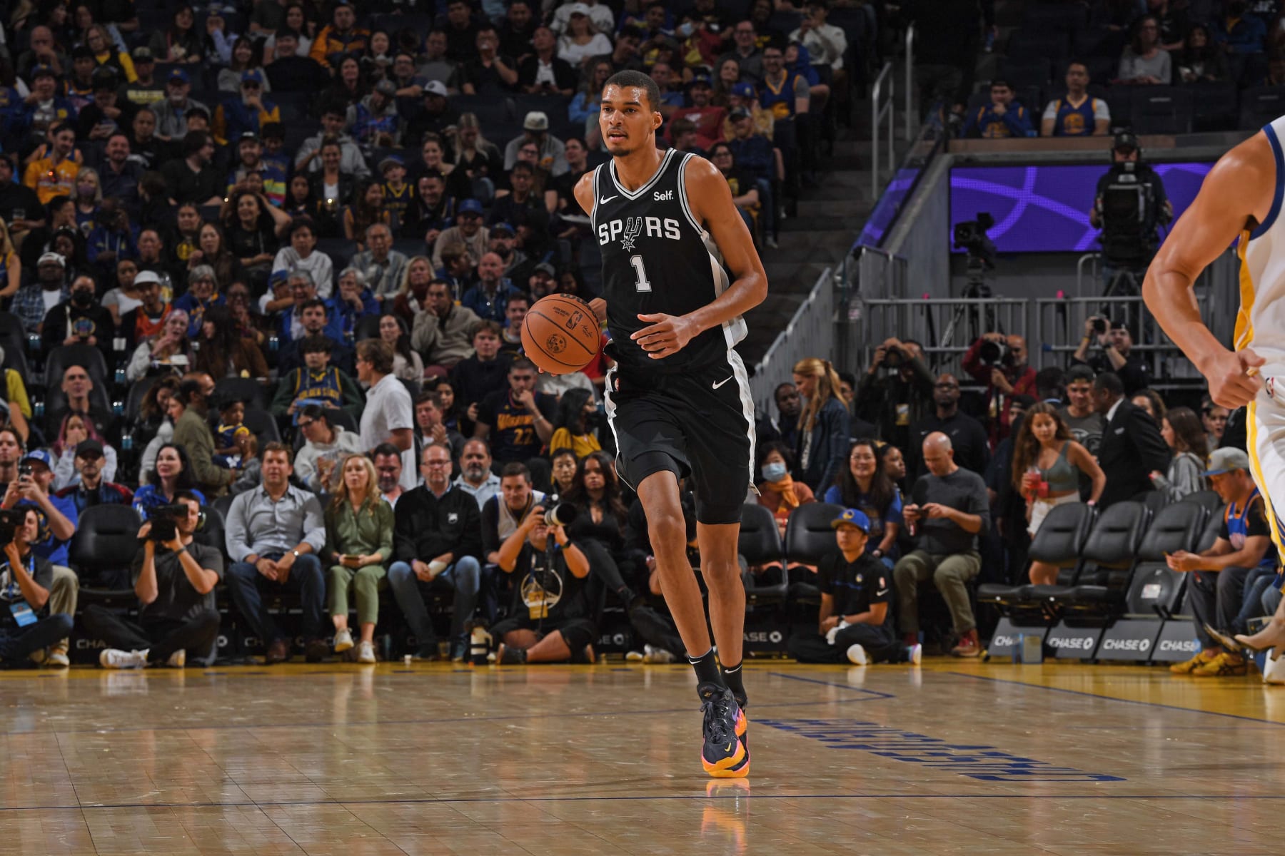 SAN FRANCISCO, CA - OCTOBER 20: Victor Wembanyama #1 of the San Antonio Spurs dribbles the ball during the game against the Golden State Warriors on October 20, 2023 at Chase Center in San Francisco, California. NOTE TO USER: User expressly acknowledges and agrees that, by downloading and or using this photograph, user is consenting to the terms and conditions of Getty Images License Agreement. Mandatory Copyright Notice: Copyright 2023 NBAE (Photo by Noah Graham/NBAE via Getty Images)
