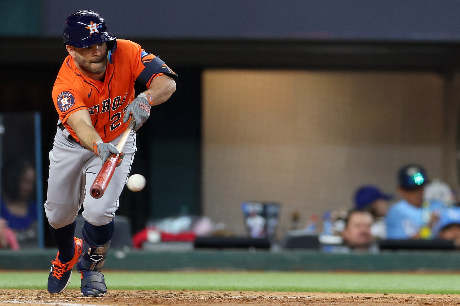 ARLINGTON, TEXAS - OCTOBER 20: Jose Altuve #27 of the Houston Astros bunts against the Texas Rangers during the fifth inning in Game Five of the American League Championship Series at Globe Life Field on October 20, 2023 in Arlington, Texas. (Photo by Stacy Revere/Getty Images)