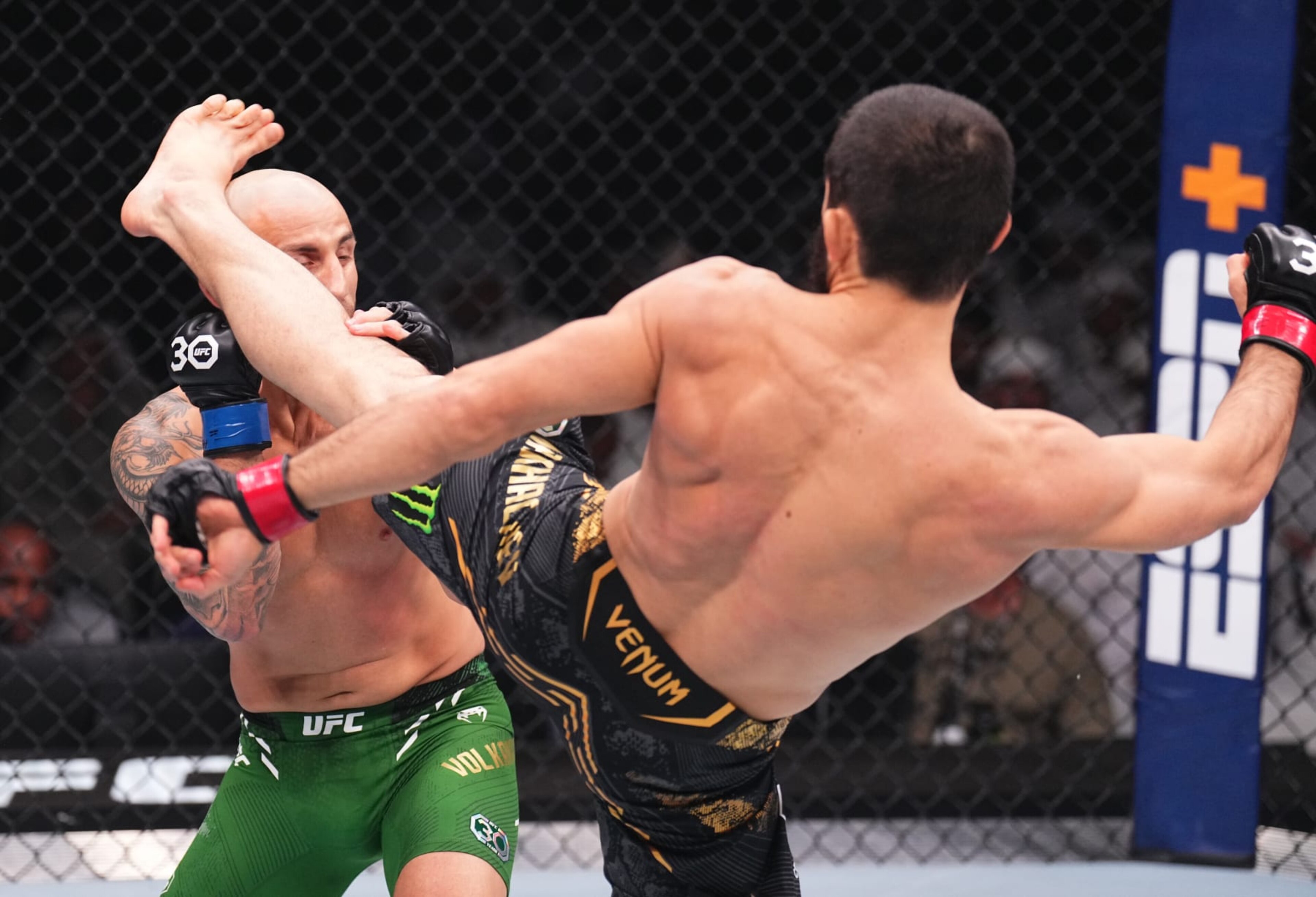 ABU DHABI, UNITED ARAB EMIRATES - OCTOBER 21: (R-L) Islam Makhachev of Russia kicks Alexander Volkanovski of Australia in the UFC lightweight championship fight during the UFC 294 event at Etihad Arena on October 21, 2023 in Abu Dhabi, United Arab Emirates. (Photo by Chris Unger/Zuffa LLC via Getty Images)