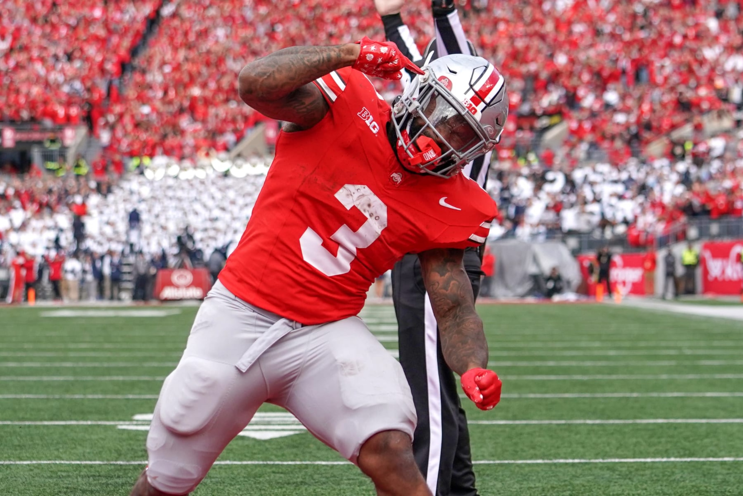 COLUMBUS, OH - OCTOBER 21: Running back Miyan Williams #3 of the Ohio State Buckeyes celebrates a touchdown during the game against the Penn State Nittany Lions at Ohio Stadium in Columbus, Ohio on October 21, 2023. (Photo by Jason Mowry/Icon Sportswire via Getty Images)