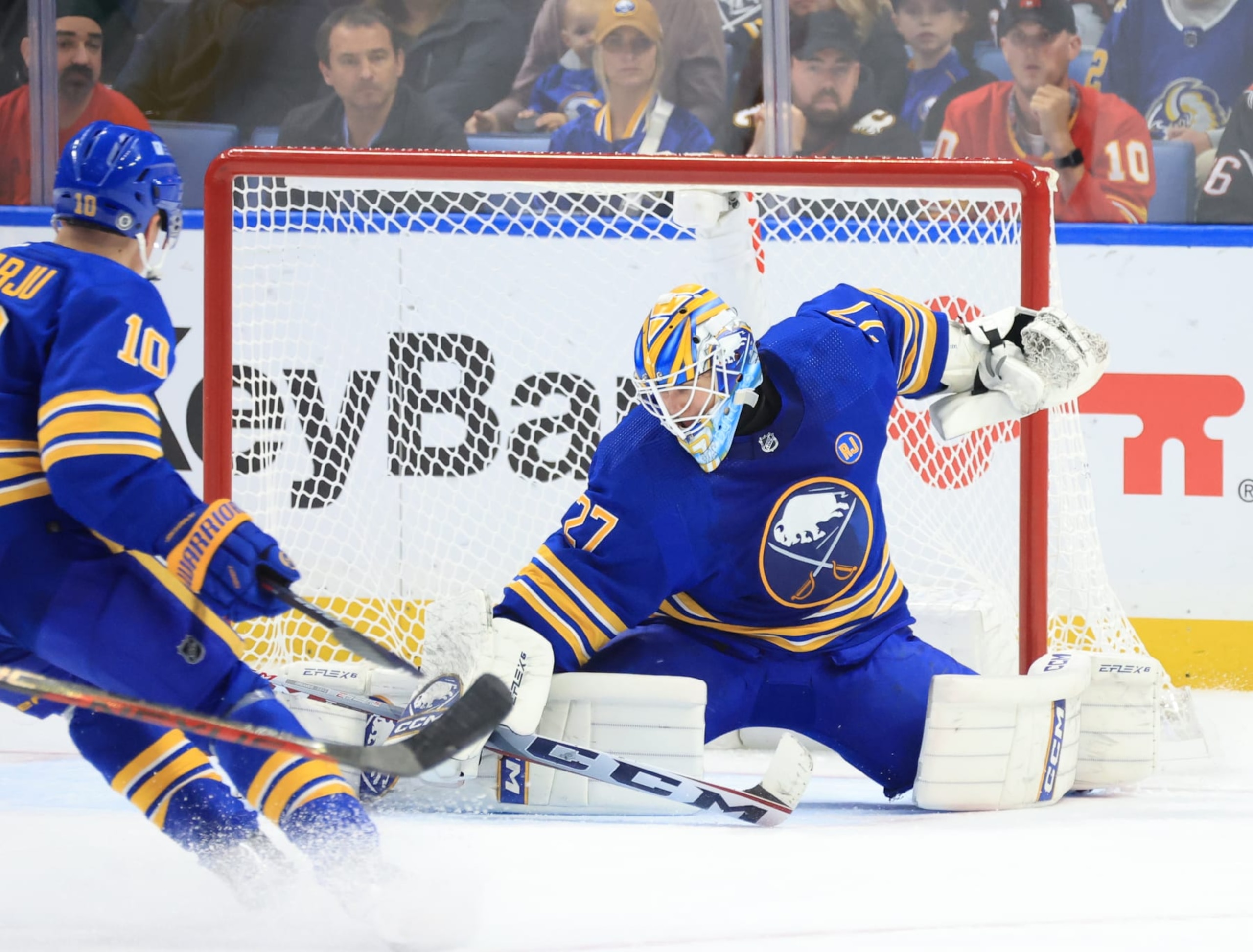 BUFFALO, NEW YORK - OCTOBER 19: Devon Levi #27 of the Buffalo Sabres makes a save against the Calgary Flames during an NHL game on October 19, 2023 at KeyBank Center in Buffalo, New York. (Photo by Bill Wippert/NHLI via Getty Images)