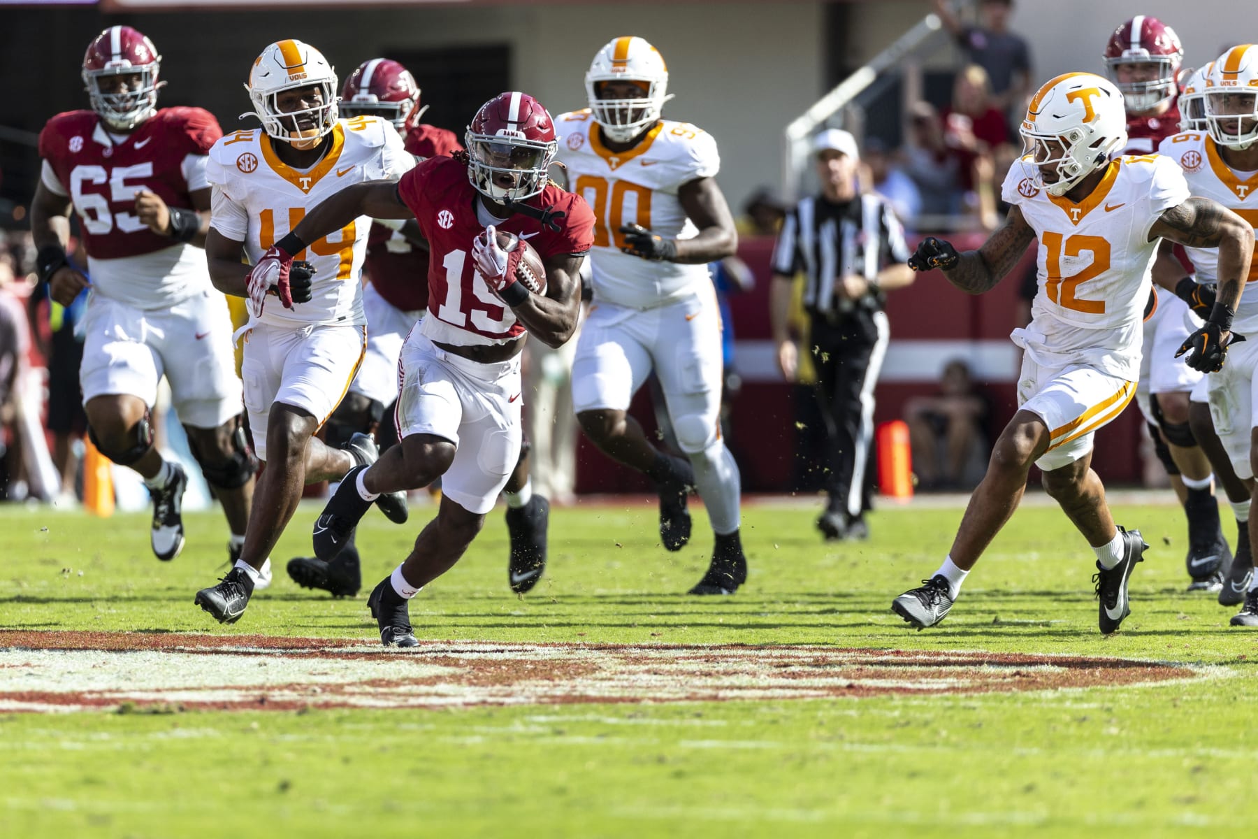 Alabama wide receiver Kendrick Law (19) runs the ball as Tennessee defensive back Tamarion McDonald (12) chases during the first half of an NCAA college football game, Saturday, Oct. 21, 2023, in Tuscaloosa, Ala. (AP Photo/Vasha Hunt)