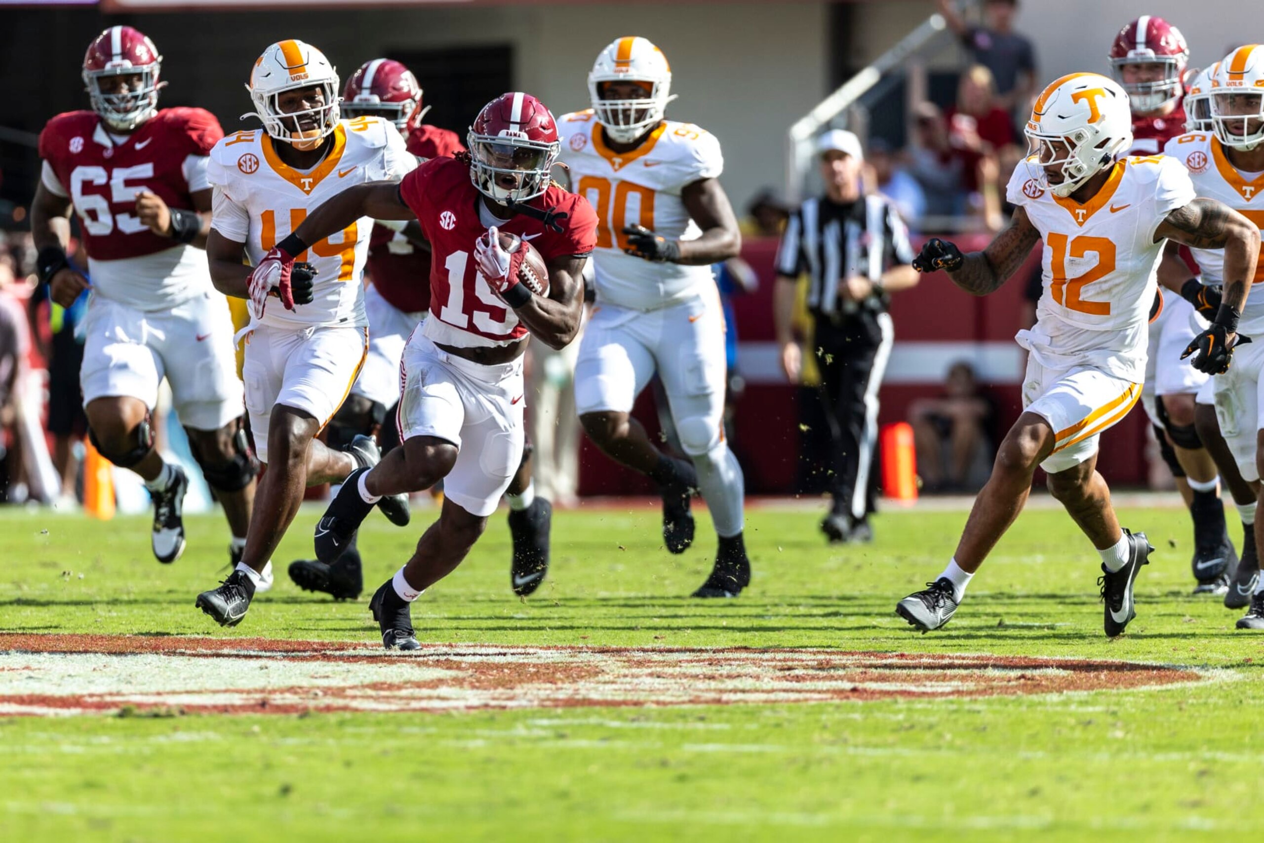 Alabama wide receiver Kendrick Law (19) runs the ball as Tennessee defensive back Tamarion McDonald (12) chases during the first half of an NCAA college football game, Saturday, Oct. 21, 2023, in Tuscaloosa, Ala. (AP Photo/Vasha Hunt)