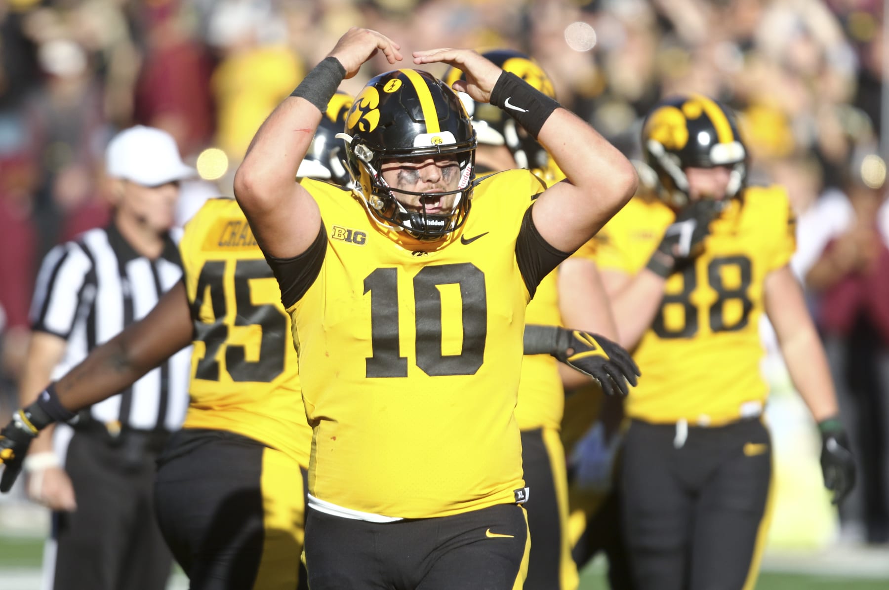IOWA CITY, IOWA- OCTOBER 21:  Quarterback Deacon Hill #10 of the Iowa Hawkeyes celebrates a touchdown during the first half against the Minnesota Golden Gophers at Kinnick Stadium on October 21, 2023 in Iowa City, Iowa.  (Photo by Matthew Holst/Getty Images)