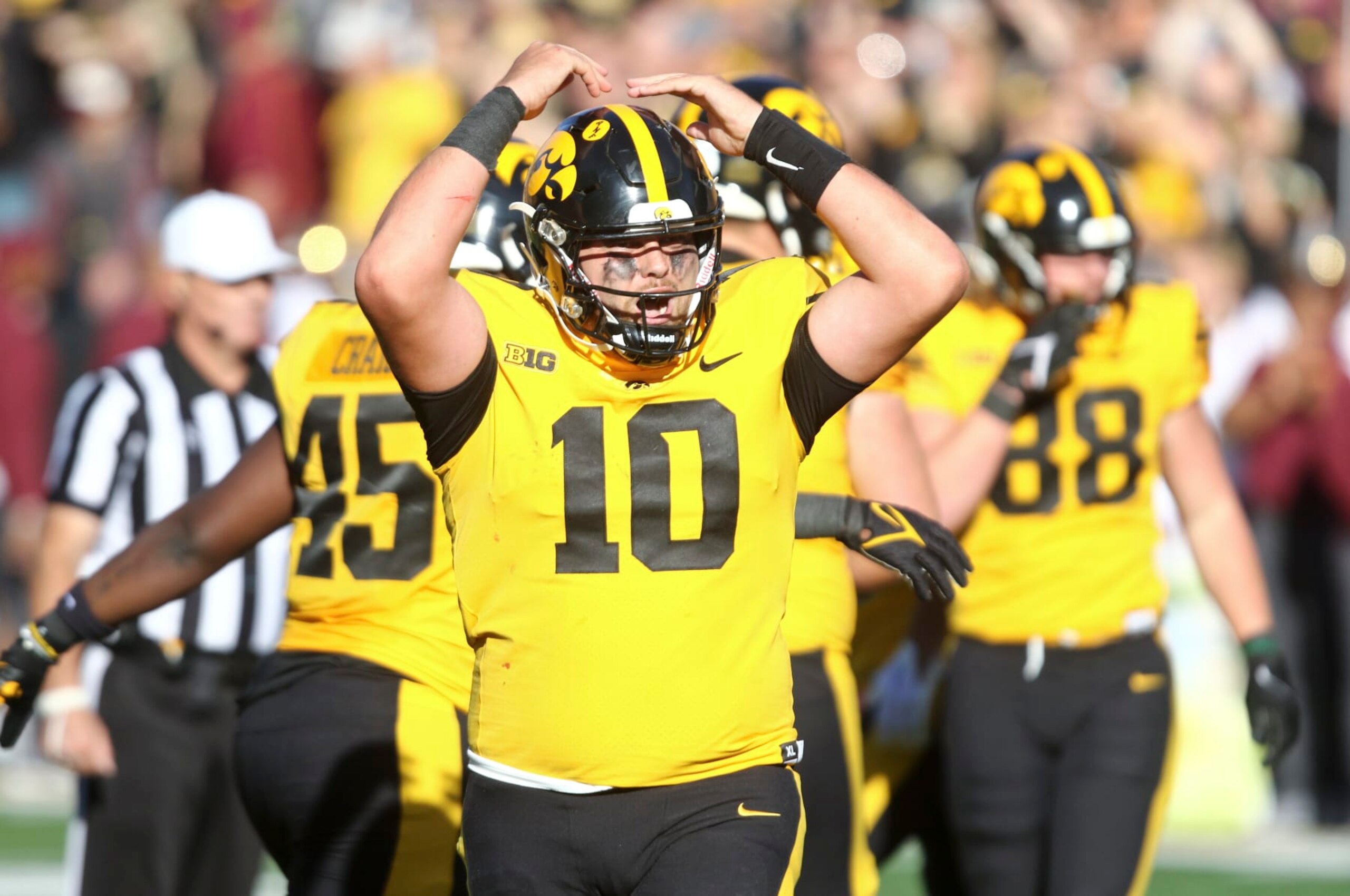IOWA CITY, IOWA- OCTOBER 21:  Quarterback Deacon Hill #10 of the Iowa Hawkeyes celebrates a touchdown during the first half against the Minnesota Golden Gophers at Kinnick Stadium on October 21, 2023 in Iowa City, Iowa.  (Photo by Matthew Holst/Getty Images)
