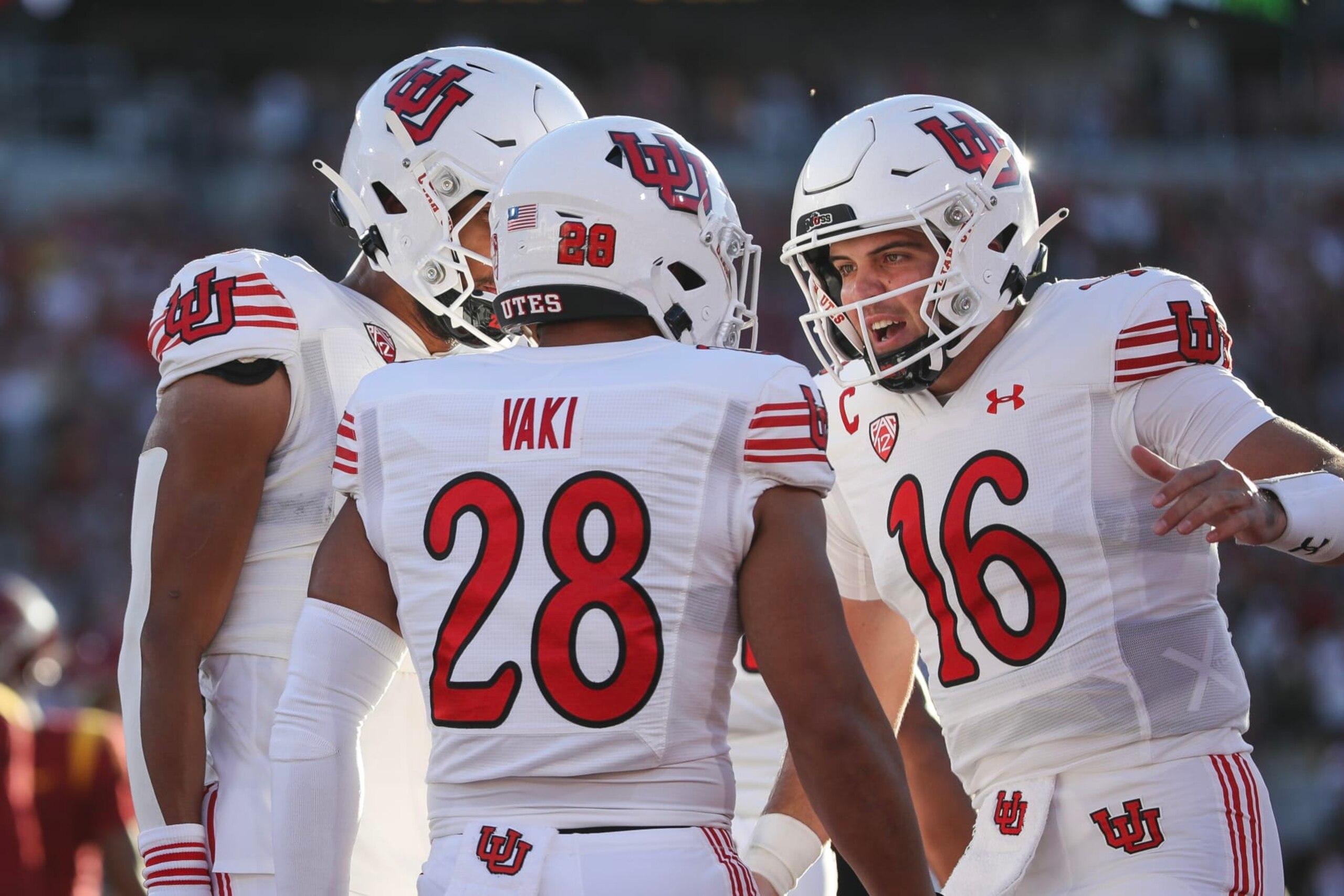 LOS ANGELES, CALIFORNIA - OCTOBER 21: Sione Vaki #28 of the Utah Utes celebrates his touchdown with Bryson Barnes #16 in the first quarter against the USC Trojans at United Airlines Field at the Los Angeles Memorial Coliseum on October 21, 2023 in Los Angeles, California. (Photo by Meg Oliphant/Getty Images)