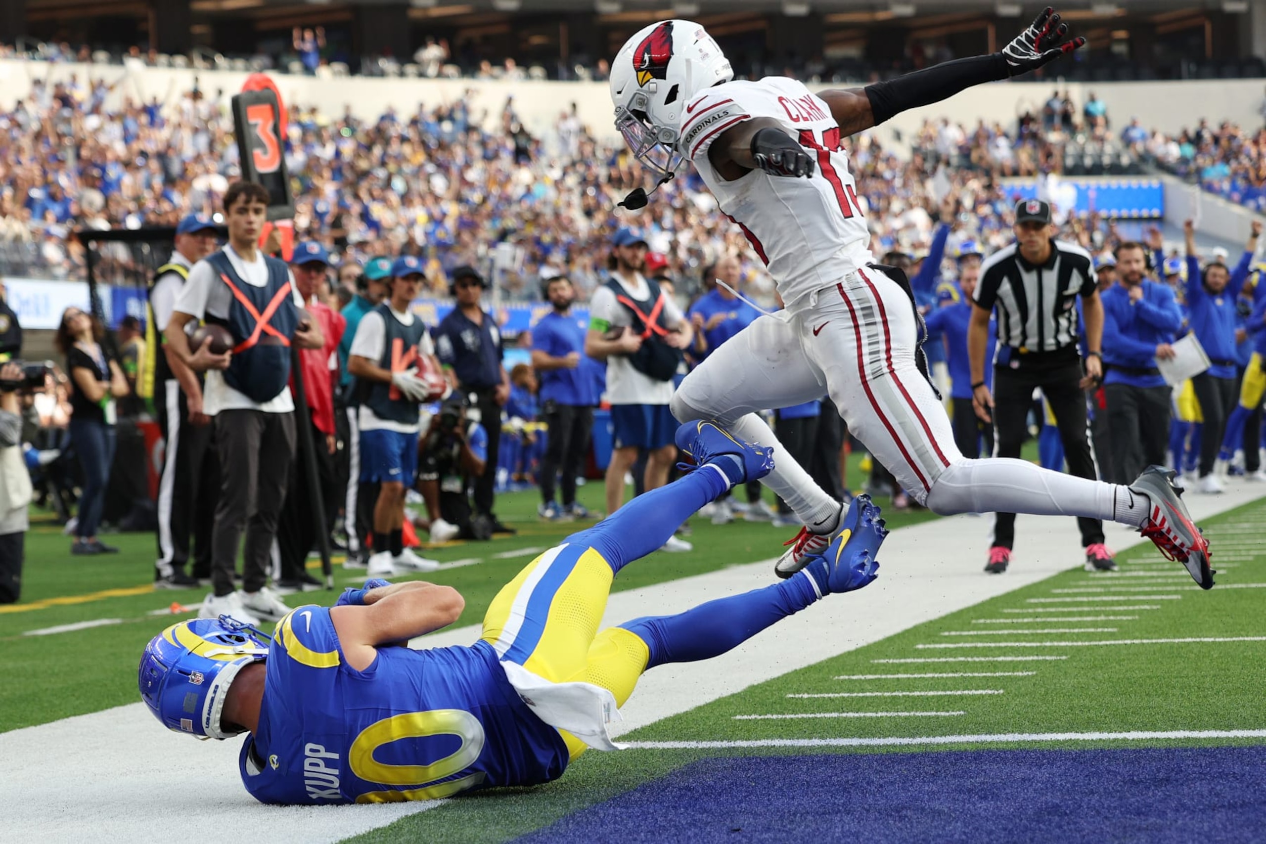 INGLEWOOD, CALIFORNIA - OCTOBER 15: Cooper Kupp #10 of the Los Angeles Rams scores a receiving touchdown against Kei'Trel Clark #13 of the Arizona Cardinals during the third quarter at SoFi Stadium on October 15, 2023 in Inglewood, California. (Photo by Harry How/Getty Images)