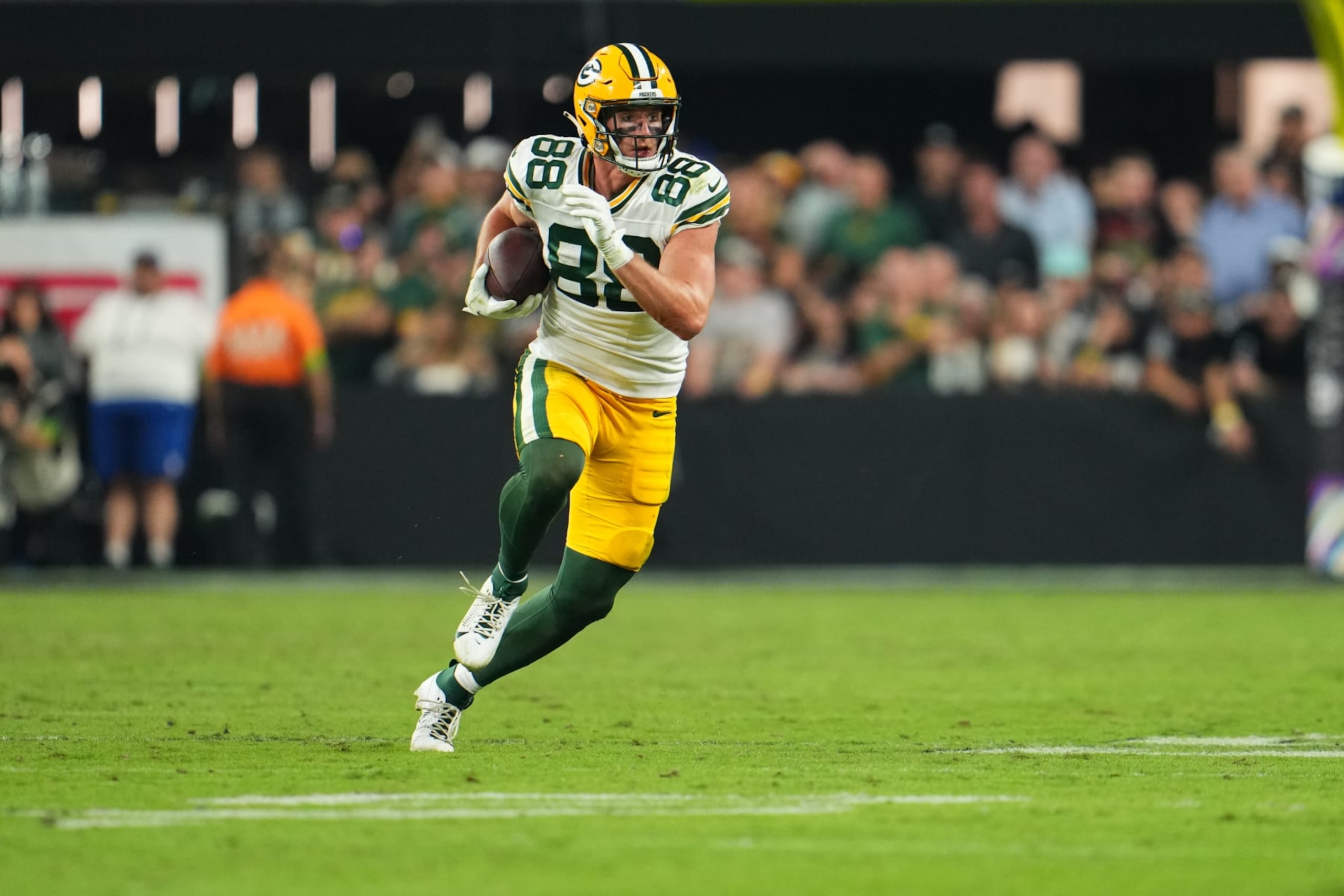 LAS VEGAS, NV - OCTOBER 09: Luke Musgrave #88 of the Green Bay Packers runs with the ball against the Las Vegas Raiders during the second half at Allegiant Stadium on October 9, 2023 in Las Vegas, Nevada. (Photo by Cooper Neill/Getty Images)