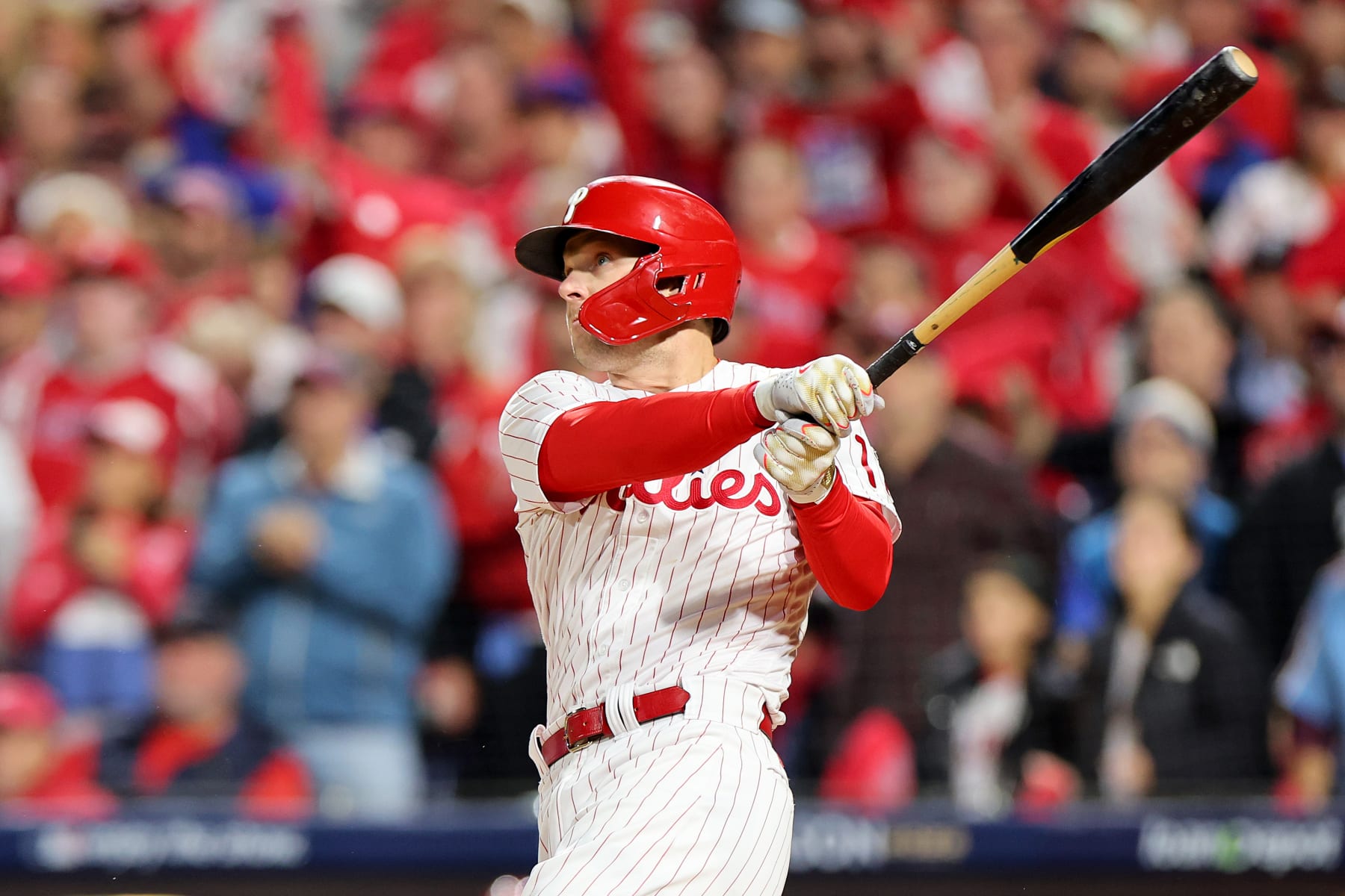 PHILADELPHIA, PENNSYLVANIA - OCTOBER 22: Rhys Hoskins #17 of the Philadelphia Phillies hits a two-run home run during the first inning against the San Diego Padres in game four of the National League Championship Series at Citizens Bank Park on October 22, 2022 in Philadelphia, Pennsylvania. (Photo by Michael Reaves/Getty Images)
