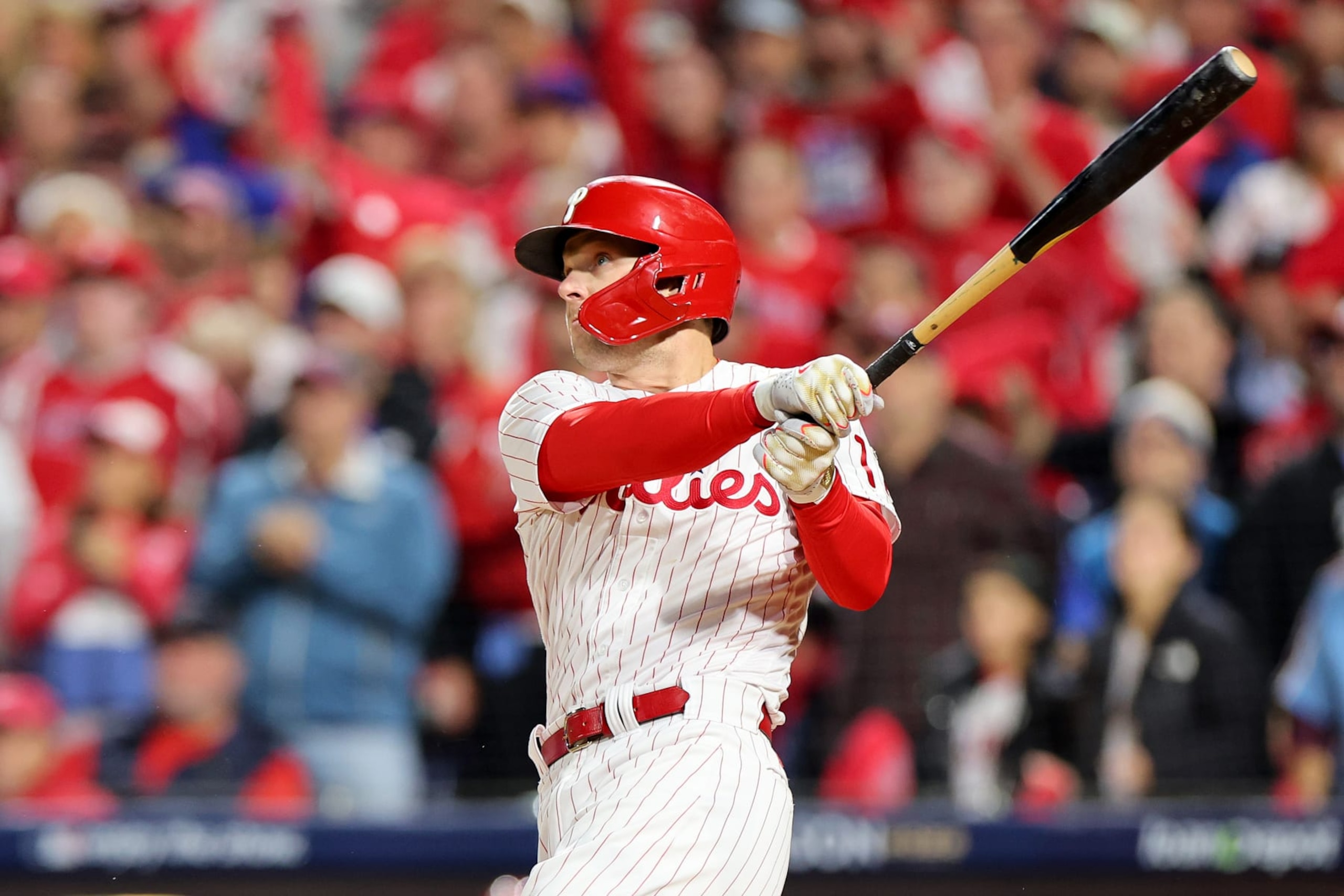 PHILADELPHIA, PENNSYLVANIA - OCTOBER 22: Rhys Hoskins #17 of the Philadelphia Phillies hits a two-run home run during the first inning against the San Diego Padres in game four of the National League Championship Series at Citizens Bank Park on October 22, 2022 in Philadelphia, Pennsylvania. (Photo by Michael Reaves/Getty Images)