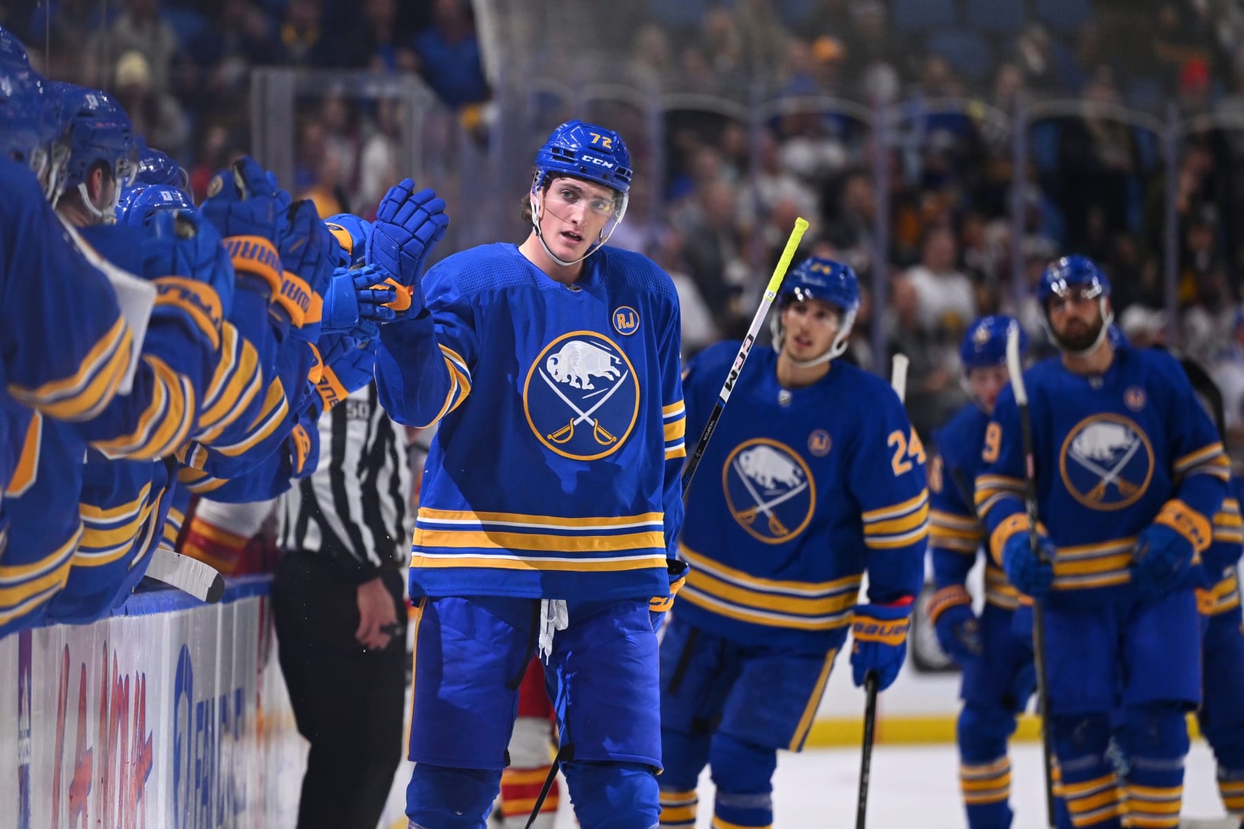 BUFFALO, NEW YORK - OCTOBER 19: Tage Thompson #72 of the Buffalo Sabres celebrates his first period goal with teammates on the bench during an NHL game against the Calgary Flames on October 19, 2023 at KeyBank Center in Buffalo, New York. (Photo by Joe Hrycych/NHLI via Getty Images)
