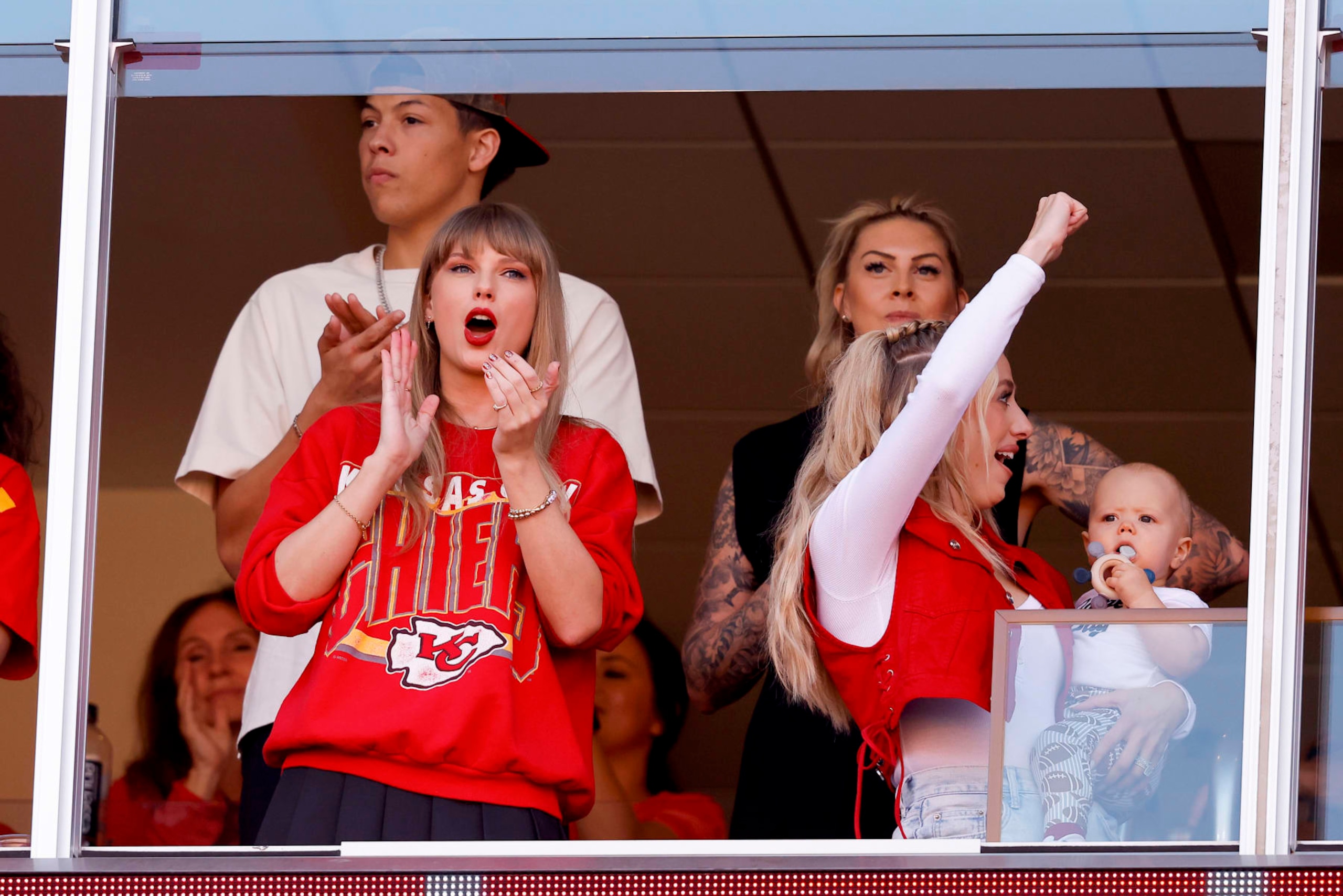 KANSAS CITY, MISSOURI - OCTOBER 22: Taylor Swift and Brittany Mahomes cheer during a game between the Los Angeles Chargers and Kansas City Chiefs at GEHA Field at Arrowhead Stadium on October 22, 2023 in Kansas City, Missouri. (Photo by David Eulitt/Getty Images)