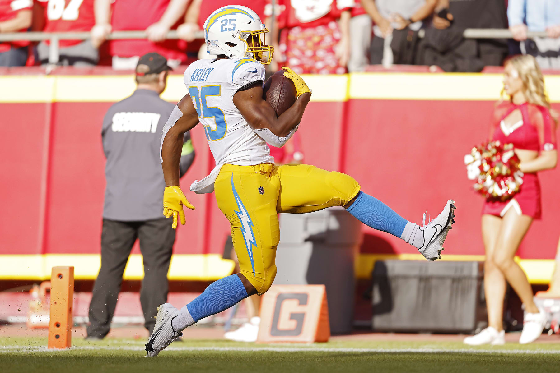 KANSAS CITY, MISSOURI - OCTOBER 22: Joshua Kelley #25 of the Los Angeles Chargers runs for a touchdown during the second quarter against the Kansas City Chiefs at GEHA Field at Arrowhead Stadium on October 22, 2023 in Kansas City, Missouri. (Photo by David Eulitt/Getty Images)