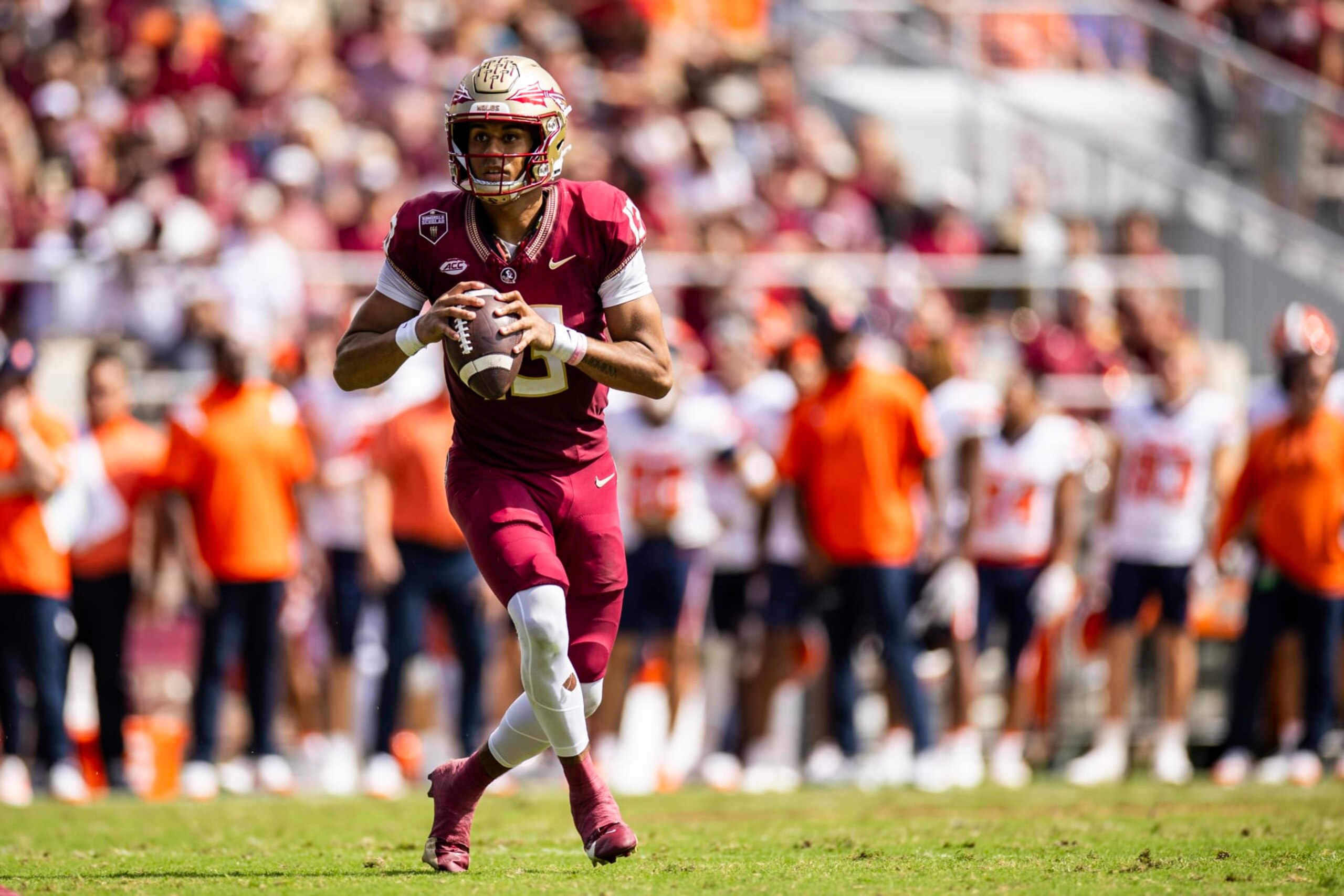 TALLAHASSEE, FLORIDA - OCTOBER 14: Jordan Travis #13 of the Florida State Seminoles looks to pass during the second half of a game against the Syracuse Orange at Doak Campbell Stadium on October 14, 2023 in Tallahassee, Florida. (Photo by James Gilbert/Getty Images)