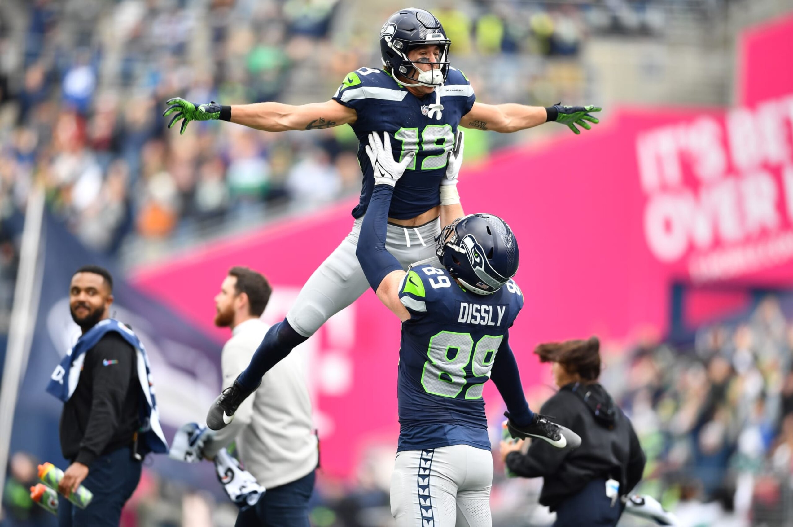 SEATTLE, WASHINGTON - OCTOBER 22: Jake Bobo #19 of the Seattle Seahawks celebrates after scoring a touchdown with Will Dissly #89 of the Seattle Seahawks in the second quarter of the game against the Arizona Cardinals at Lumen Field on October 22, 2023 in Seattle, Washington. (Photo by Jane Gershovich/Getty Images)