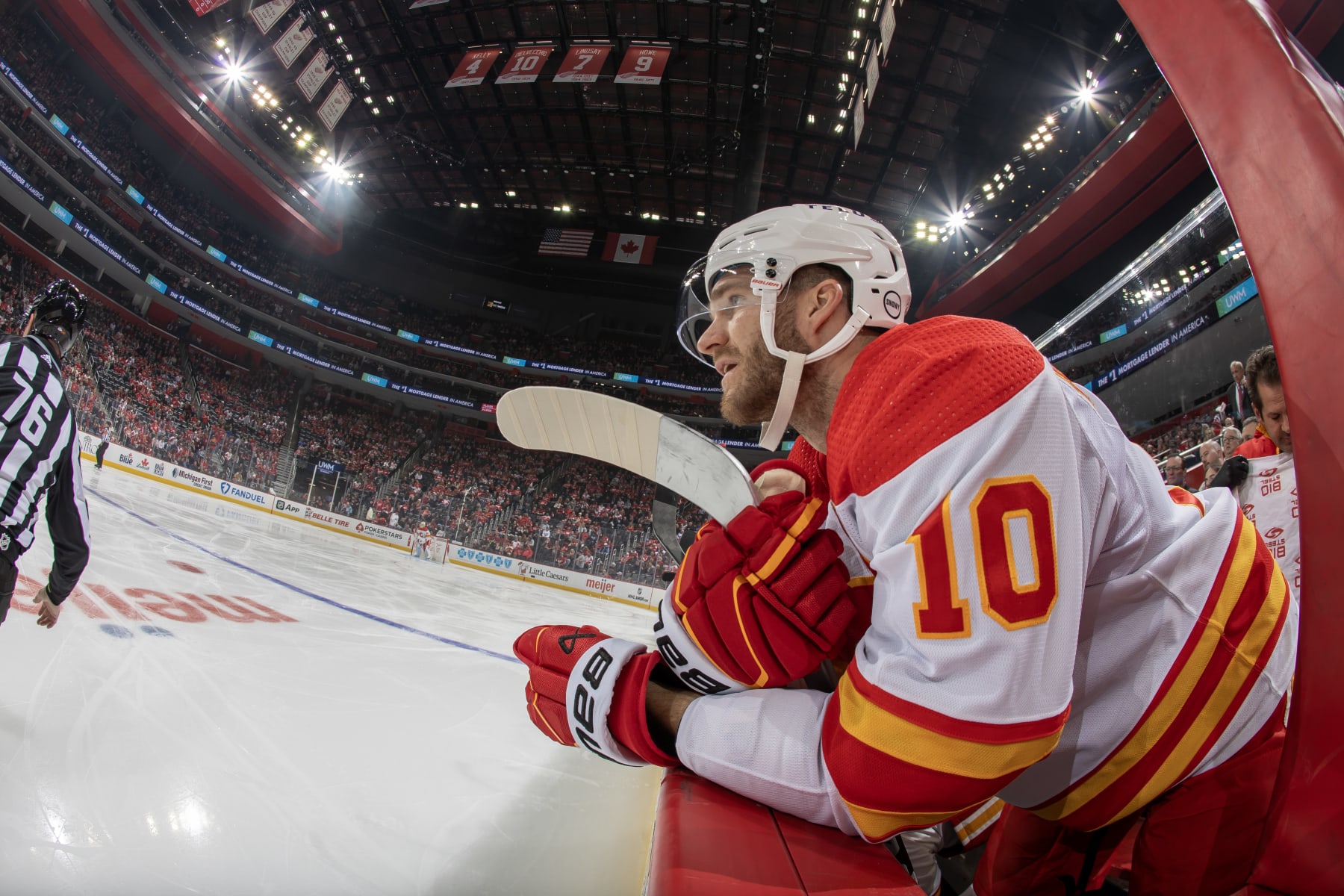 DETROIT, MI - OCTOBER 22: Jonathan Huberdeau #10 of the Calgary Flames watches the action from the bench against the Detroit Red Wings during the first period at Little Caesars Arena on October 22, 2023 in Detroit, Michigan. (Photo by Dave Reginek/NHLI via Getty Images) DETROIT, MI - OCTOBER 22: Jonathan Huberdeau #10 of the Calgary Flames watches the action from the bench against the Detroit Red Wings during the first period at Little Caesars Arena on October 22, 2023 in Detroit, Michigan. (Photo by Dave Reginek/NHLI via Getty Images)