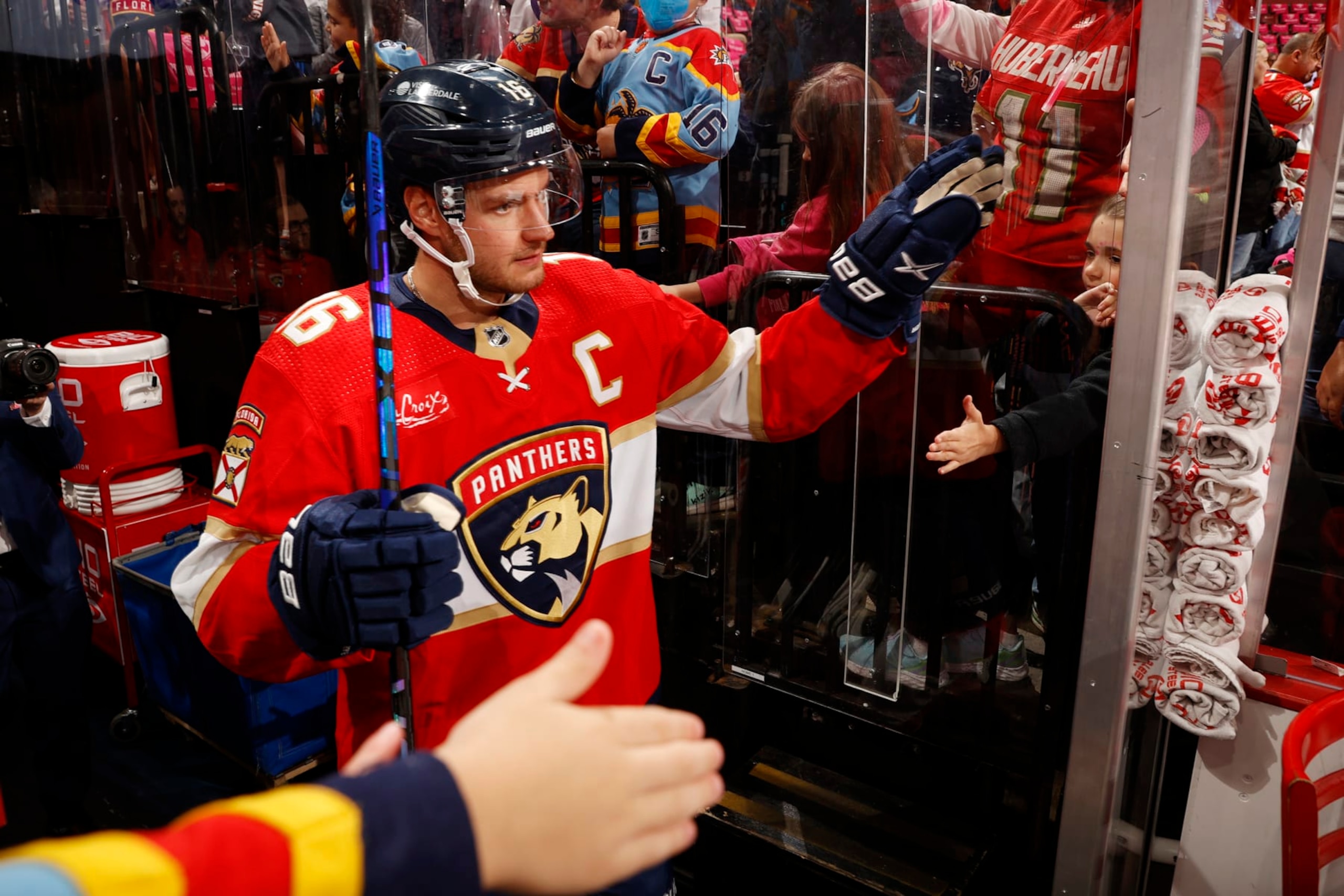 SUNRISE, FLORIDA - OCTOBER 21: Aleksander Barkov #16 of the Florida Panthers is greeted by fans on his way to the ice prior to the start of the game against the Vancouver Canucks at the Amerant Bank Arena on October 21, 2023 in Sunrise, Florida. (Photo by Eliot J. Schechter/NHLI via Getty Images)