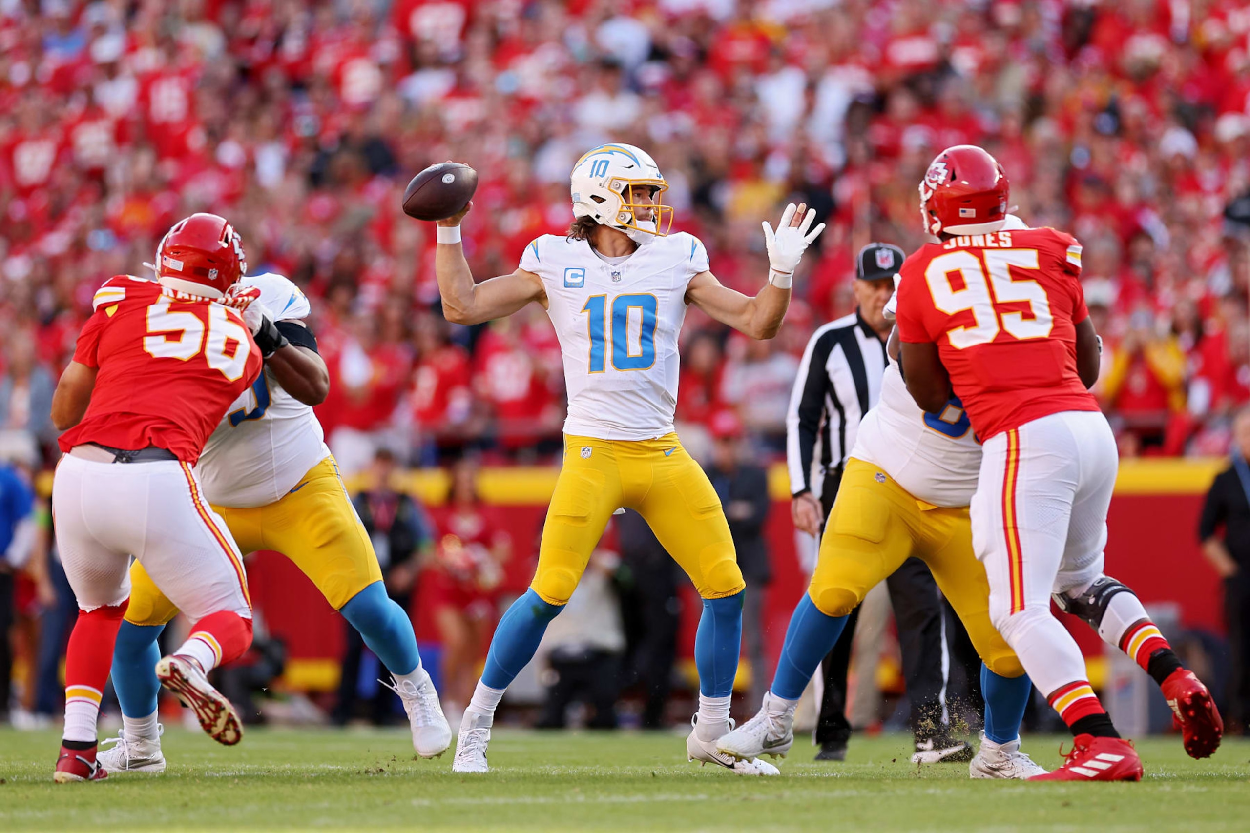 KANSAS CITY, MISSOURI - OCTOBER 22: Justin Herbert #10 of the Los Angeles Chargers throws a pass during the first quarter against the Kansas City Chiefs at GEHA Field at Arrowhead Stadium on October 22, 2023 in Kansas City, Missouri. (Photo by Jamie Squire/Getty Images)