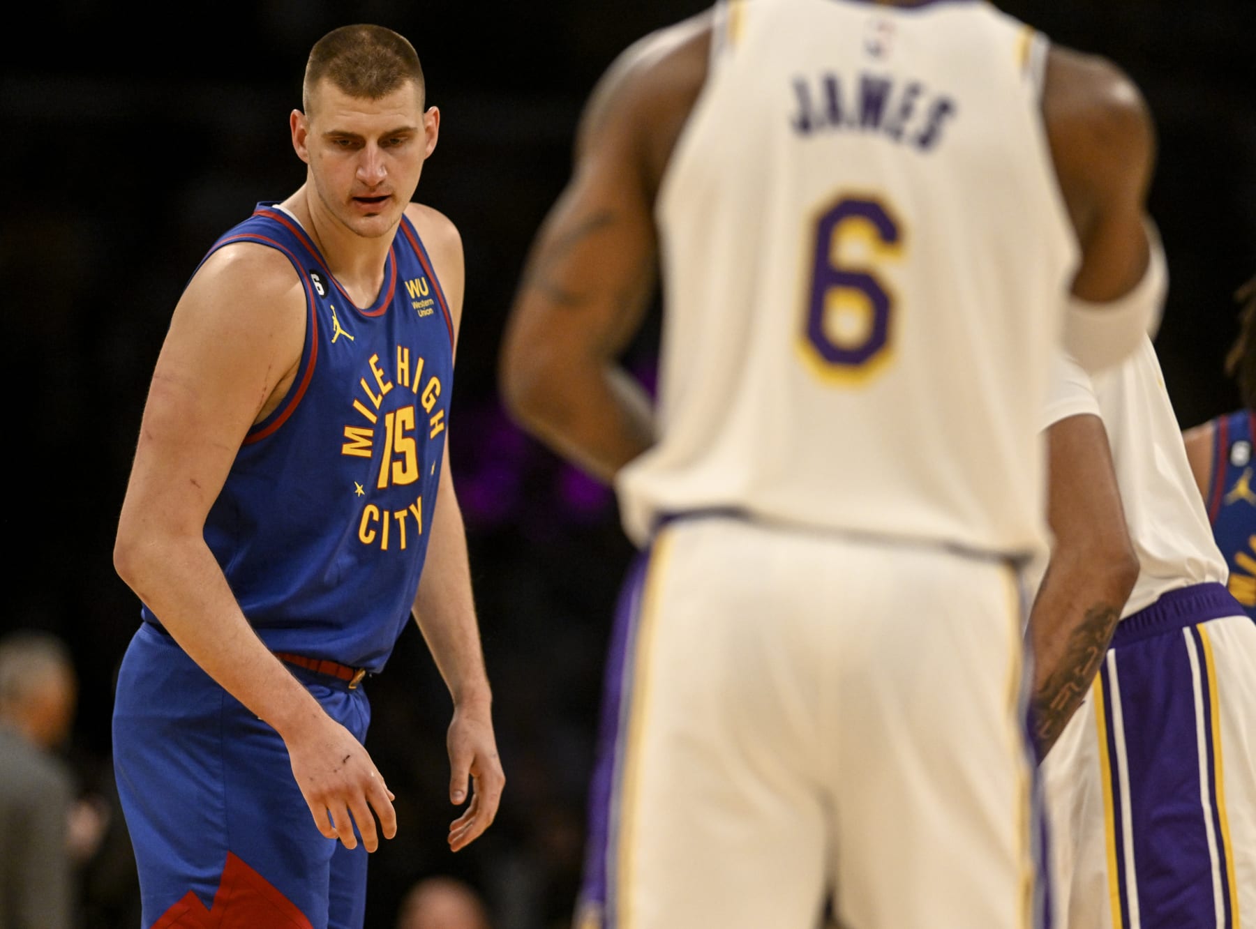 LOS ANGELES, CA - MAY 20: Nikola Jokic (15) of the Denver Nuggets prepares for tipoff as LeBron James (6) of the Los Angeles Lakers warms up before the first quarter of the Western Conference finals game 3 at Crypto.com Arena in Los Angeles on Saturday, May 20, 2023. (Photo by AAron Ontiveroz/The Denver Post)