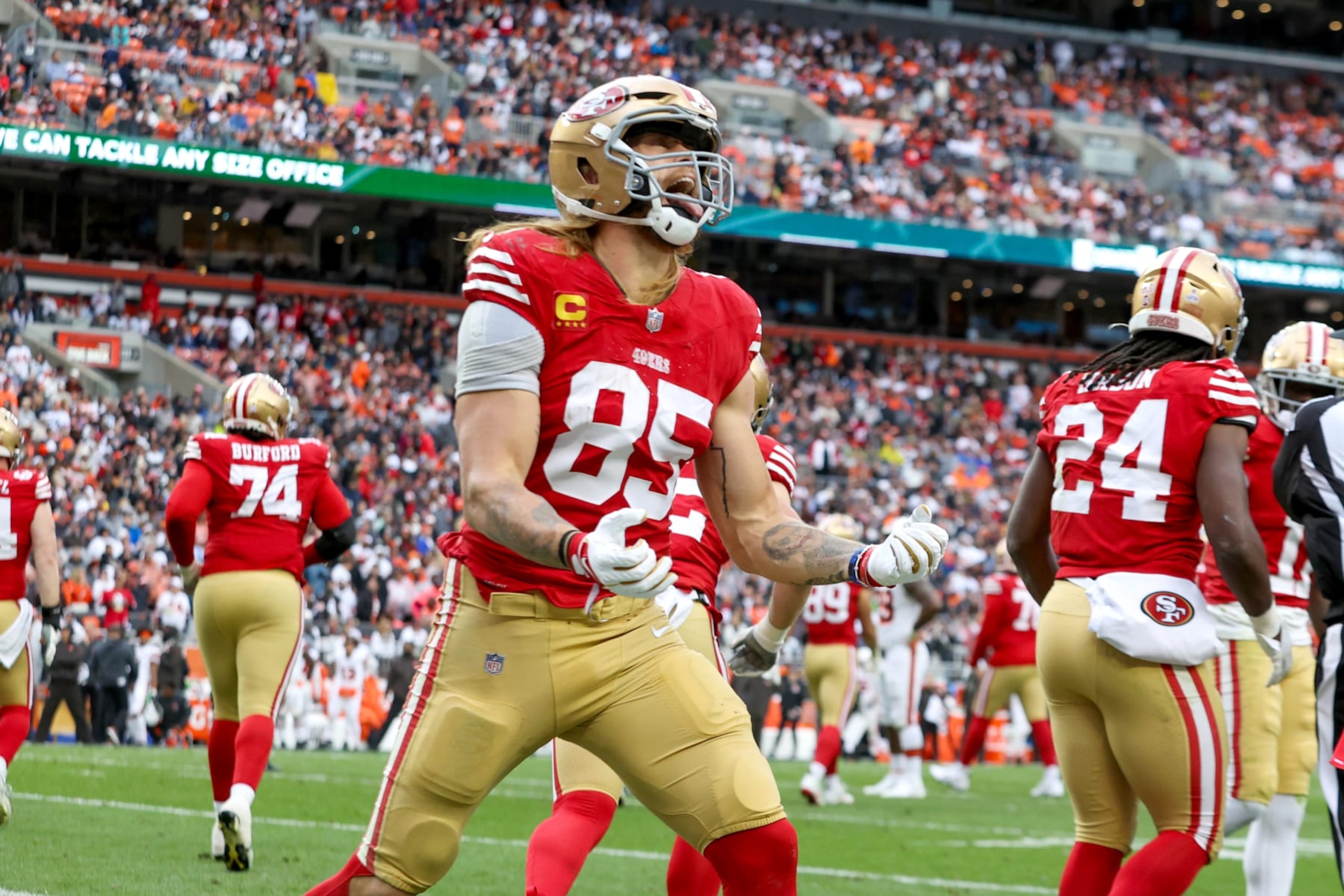 CLEVELAND, OH - OCTOBER 15: San Francisco 49ers tight end George Kittle (85) celebrates after San Francisco 49ers running back Jordan Mason (24) (not pictured) scored on an 8-yard run during the fourth quarter of the National Football League game between the San Francisco 49ers and Cleveland Browns on October 15, 2023, at Cleveland Browns Stadium in Cleveland, OH. (Photo by Frank Jansky/Icon Sportswire via Getty Images)