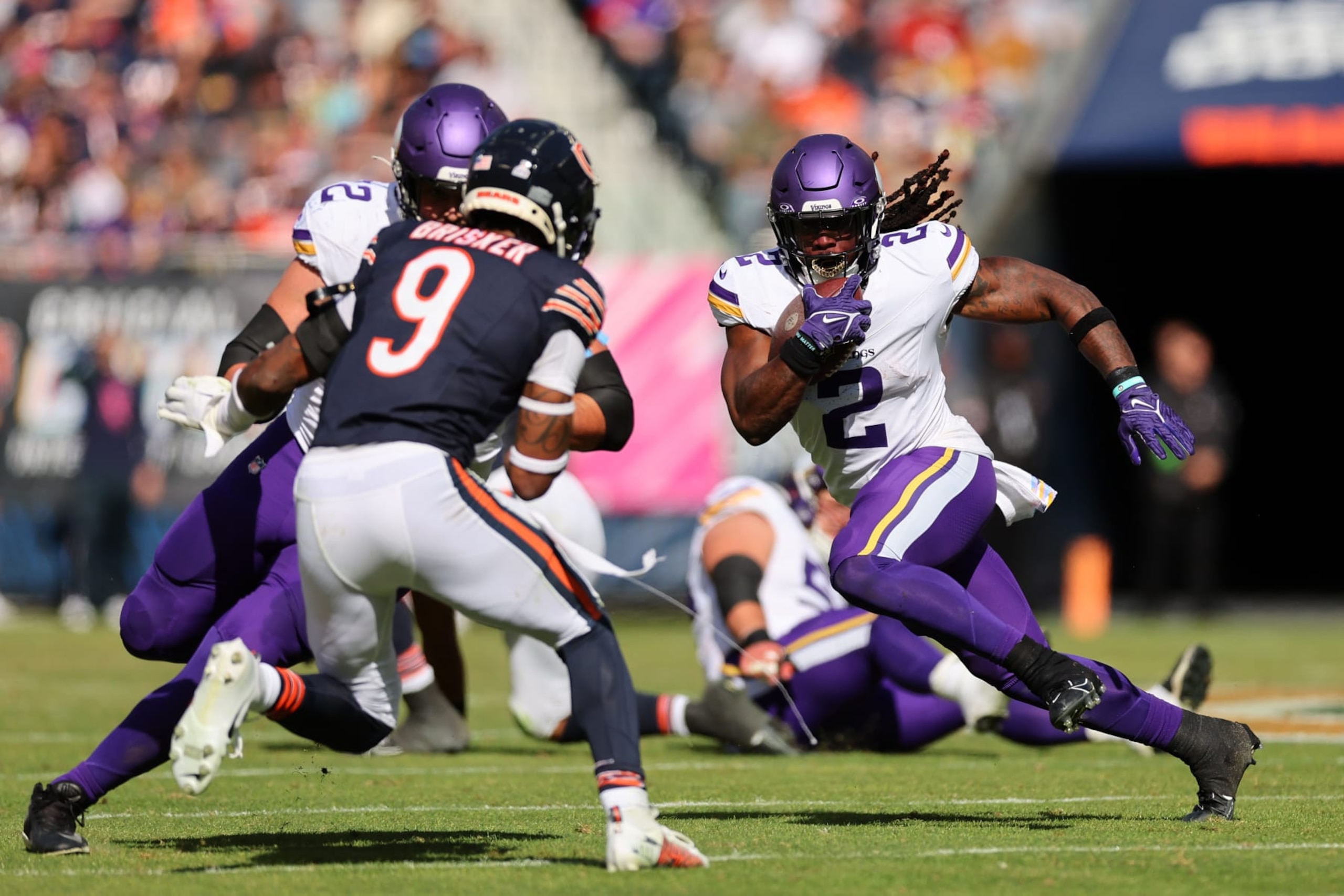 CHICAGO, ILLINOIS - OCTOBER 15: Alexander Mattison #2 of the Minnesota Vikings runs the ball after a catch during the second quarter in the game against the Chicago Bears at Soldier Field on October 15, 2023 in Chicago, Illinois. (Photo by Michael Reaves/Getty Images)