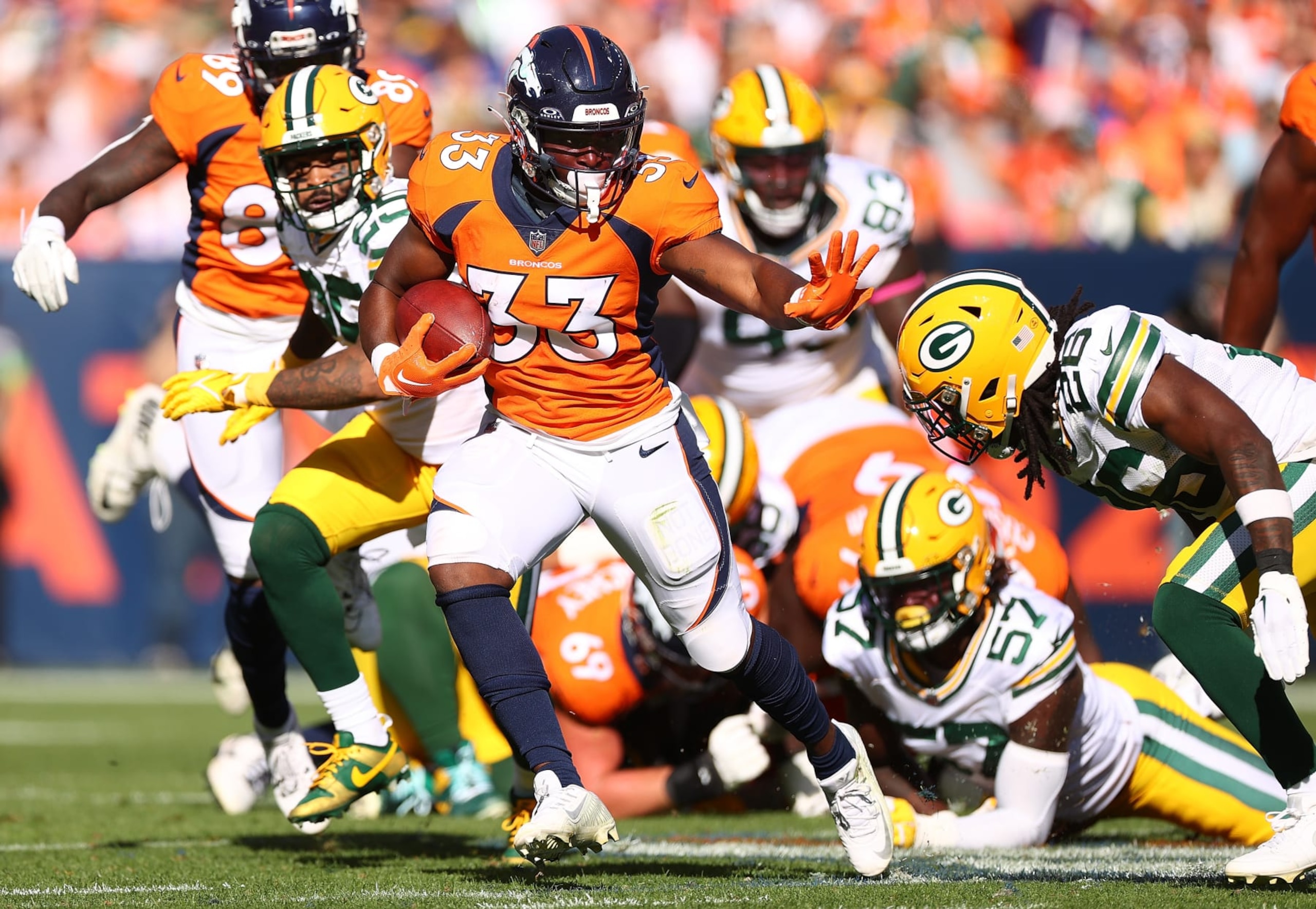 DENVER, COLORADO - OCTOBER 22: Javonte Williams #33 of the Denver Broncos carries the ball in the first half of the game against the Green Bay Packers at Empower Field At Mile High on October 22, 2023 in Denver, Colorado. (Photo by Jamie Schwaberow/Getty Images)