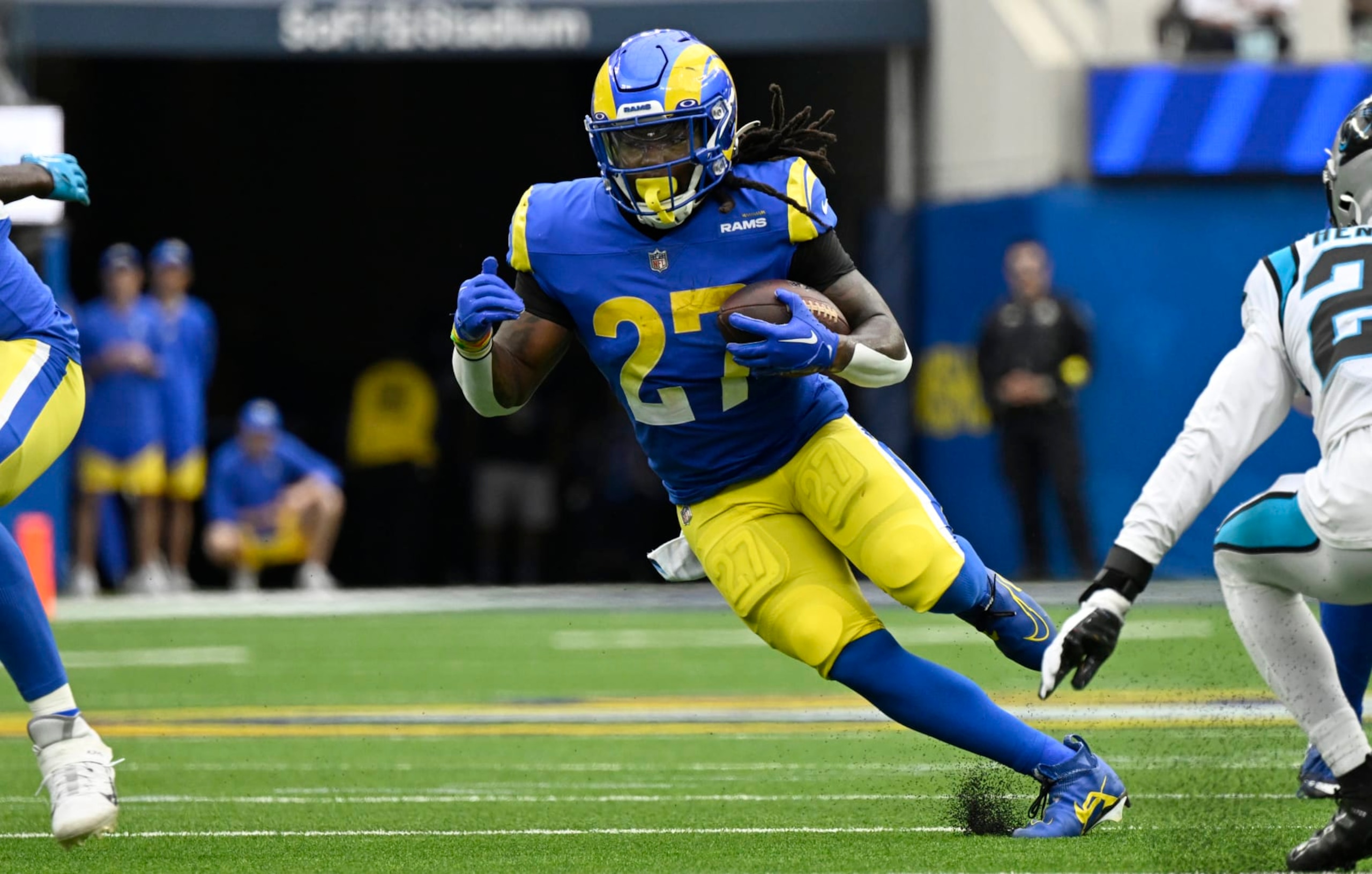 INGLEWOOD, CA - OCTOBER 16: Darrell Henderson Jr. #27 of the Los Angeles Rams runs the ball while playing the Carolina Panthers at SoFi Stadium on October 16, 2022 in Inglewood, California. (Photo by John McCoy/Getty Images) INGLEWOOD, CA - OCTOBER 16: Darrell Henderson Jr. #27 of the Los Angeles Rams runs the ball while playing the Carolina Panthers at SoFi Stadium on October 16, 2022 in Inglewood, California. (Photo by John McCoy/Getty Images)