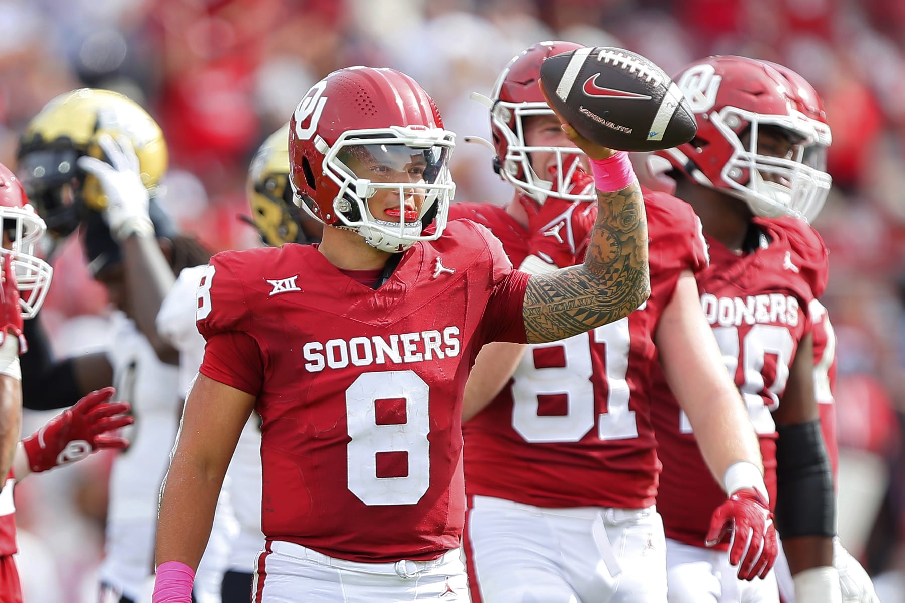 NORMAN, OKLAHOMA - OCTOBER 21:  Quarterback Dillon Gabriel #8 of the Oklahoma Sooners holds up the ball as the clock runs out against the UCF Knights in the fourth quarter at Gaylord Family Oklahoma Memorial Stadium on October 21, 2023 in Norman, Oklahoma.  Oklahoma won 31-29.  (Photo by Brian Bahr/Getty Images)