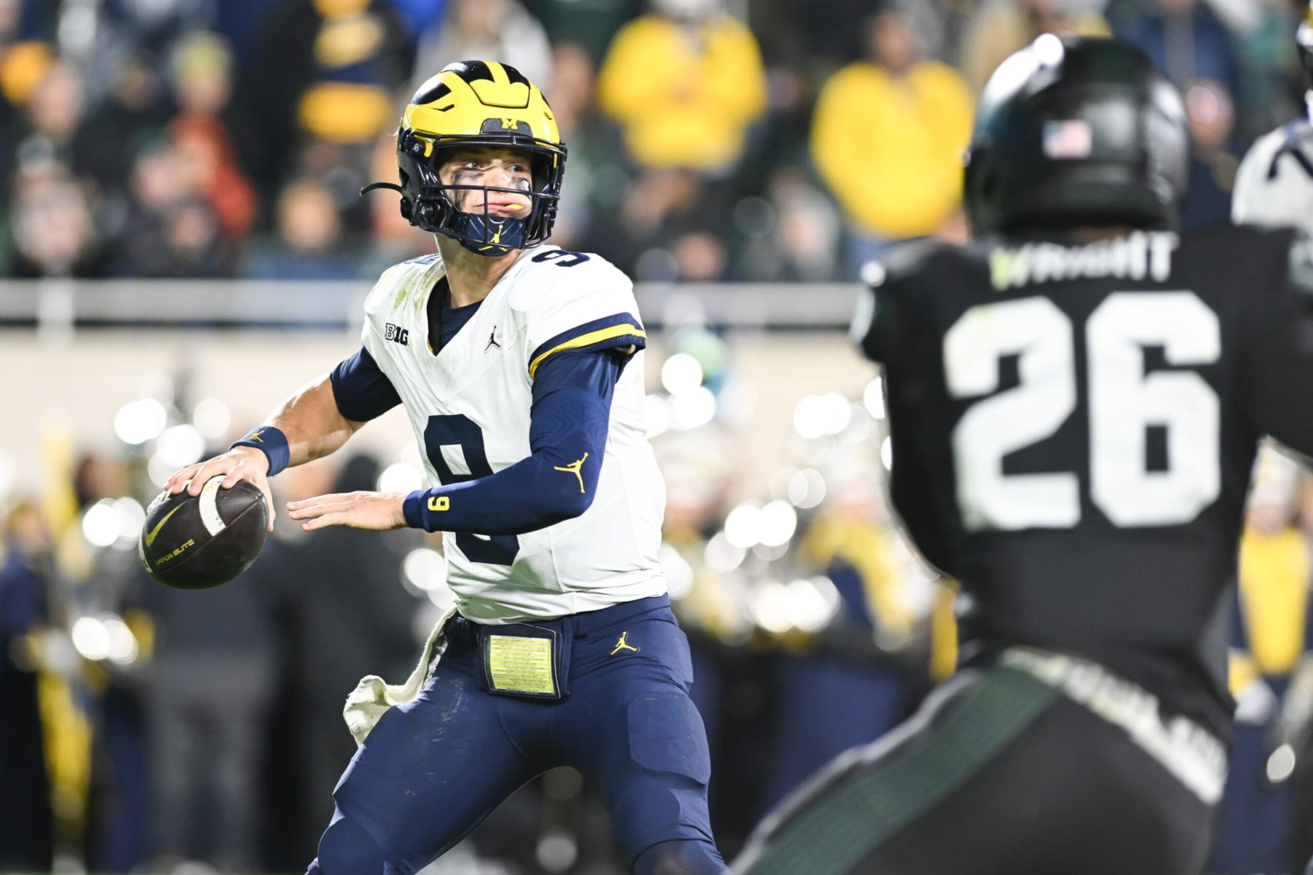 EAST LANSING, MI - OCTOBER 21: Michigan Wolverines quarterback J.J. McCarthy (9) stands in the pocket to pass during a college football game between the Michigan State Spartans and Michigan Wolverines on October 21, 2023 at Spartan Stadium in East Lansing, MI. (Photo by Adam Ruff/Icon Sportswire via Getty Images)