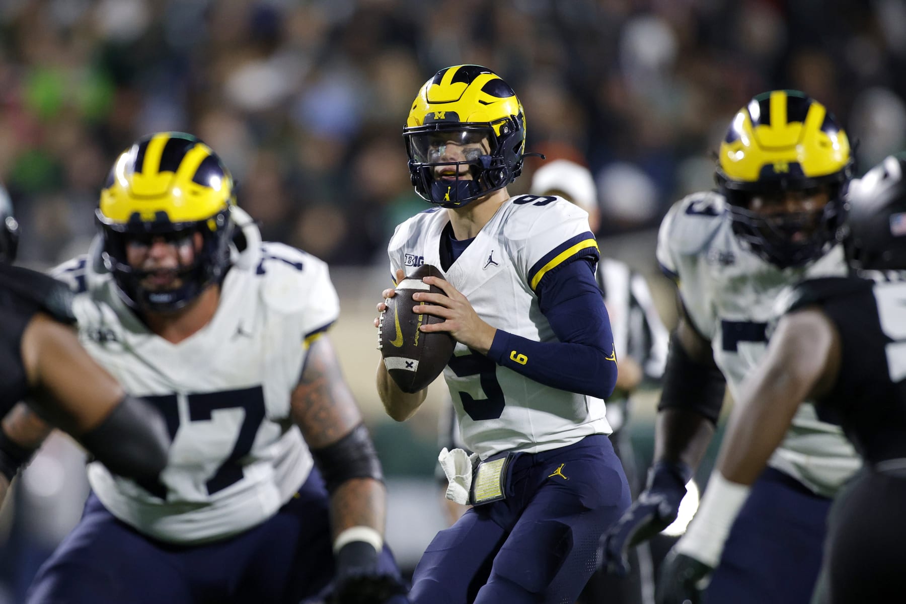 Michigan quarterback J.J. McCarthy (9) looks to throw during an NCAA college football game against Michigan State, Saturday, Oct. 21, 2023, in East Lansing, Mich. (AP Photo/Al Goldis)