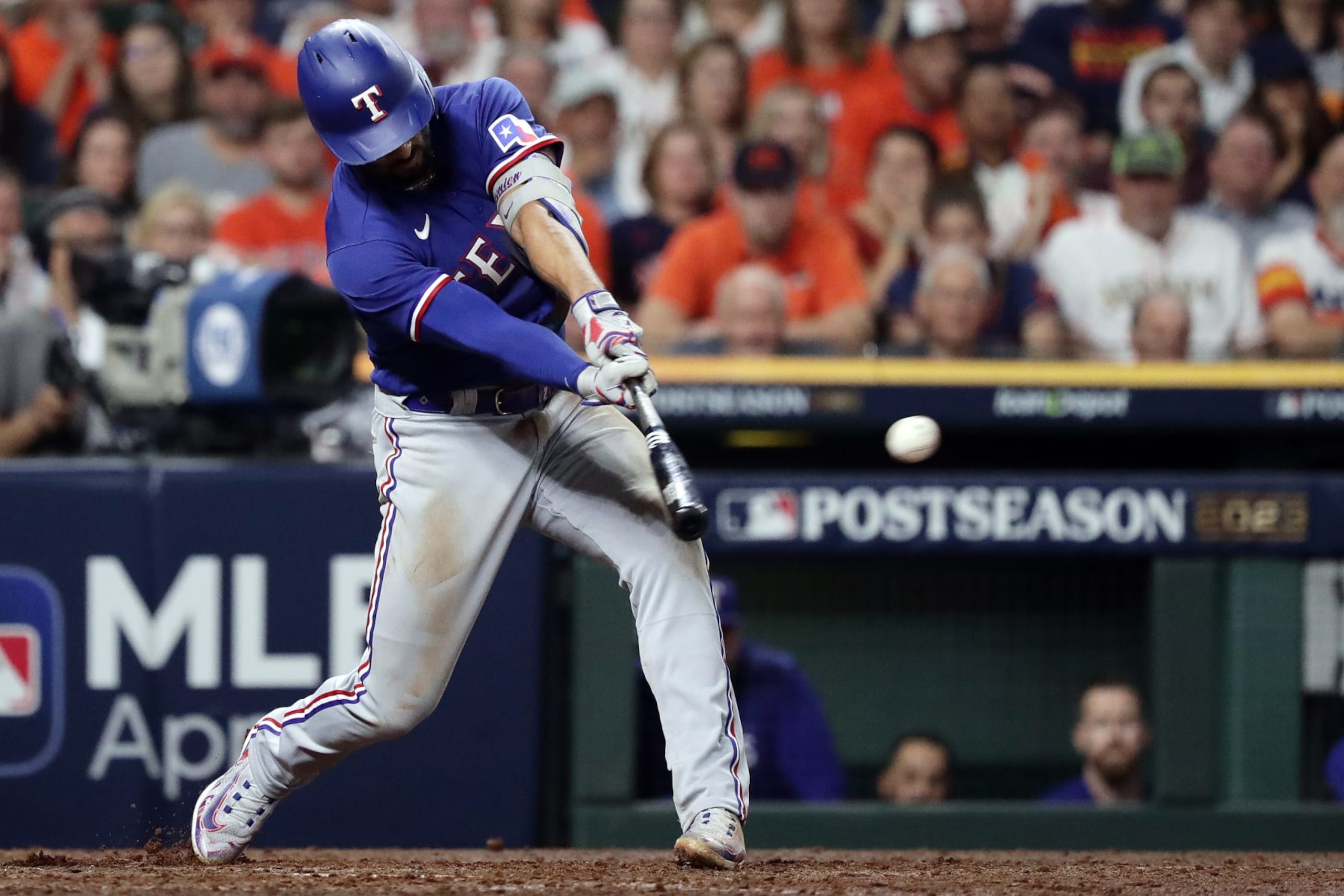 HOUSTON, TEXAS - OCTOBER 22: Marcus Semien #2 of the Texas Rangers hits a single against the Houston Astros during the ninth inning in Game Six of the American League Championship Series at Minute Maid Park on October 22, 2023 in Houston, Texas. (Photo by Bob Levey/Getty Images)