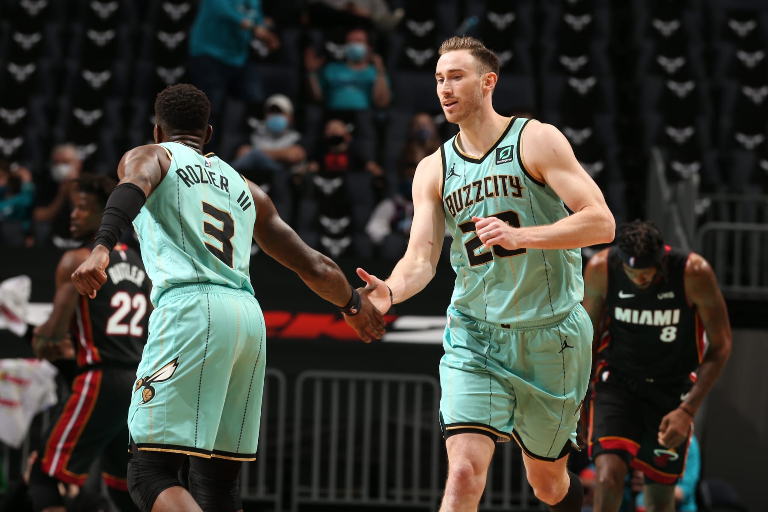 CHARLOTTE, NC - MARCH 26: Gordon Hayward #20 hi-fives Terry Rozier #3 of the Charlotte Hornets during the game against the Miami Heat on March 26, 2021 at Spectrum Center in Charlotte, North Carolina. NOTE TO USER: User expressly acknowledges and agrees that, by downloading and or using this photograph, User is consenting to the terms and conditions of the Getty Images License Agreement. Mandatory Copyright Notice: Copyright 2021 NBAE (Photo by Kent Smith/NBAE via Getty Images) CHARLOTTE, NC - MARCH 26: Gordon Hayward #20 hi-fives Terry Rozier #3 of the Charlotte Hornets during the game against the Miami Heat on March 26, 2021 at Spectrum Center in Charlotte, North Carolina. NOTE TO USER: User expressly acknowledges and agrees that, by downloading and or using this photograph, User is consenting to the terms and conditions of the Getty Images License Agreement. Mandatory Copyright Notice: Copyright 2021 NBAE (Photo by Kent Smith/NBAE via Getty Images)
