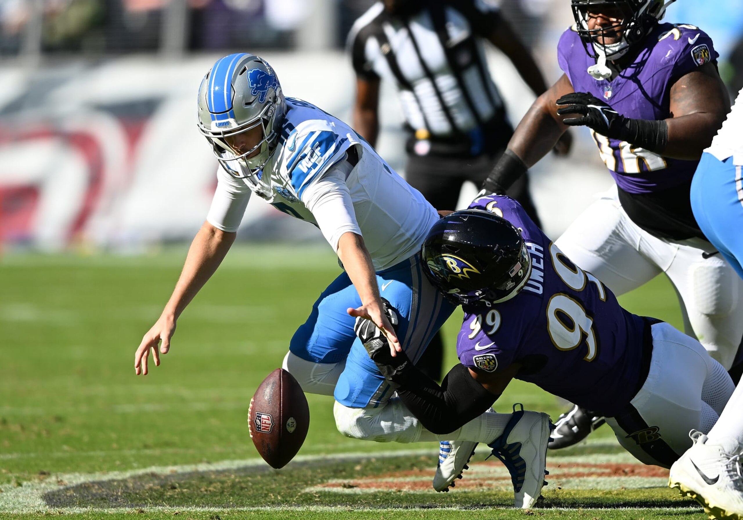 BALTIMORE, MARYLAND - OCTOBER 22: Jared Goff #16 of the Detroit Lions fumbles the ball as he is sacked by Odafe Oweh #99 of the Baltimore Ravens in the third quarter of the game at M&T Bank Stadium on October 22, 2023 in Baltimore, Maryland. (Photo by Greg Fiume/Getty Images)