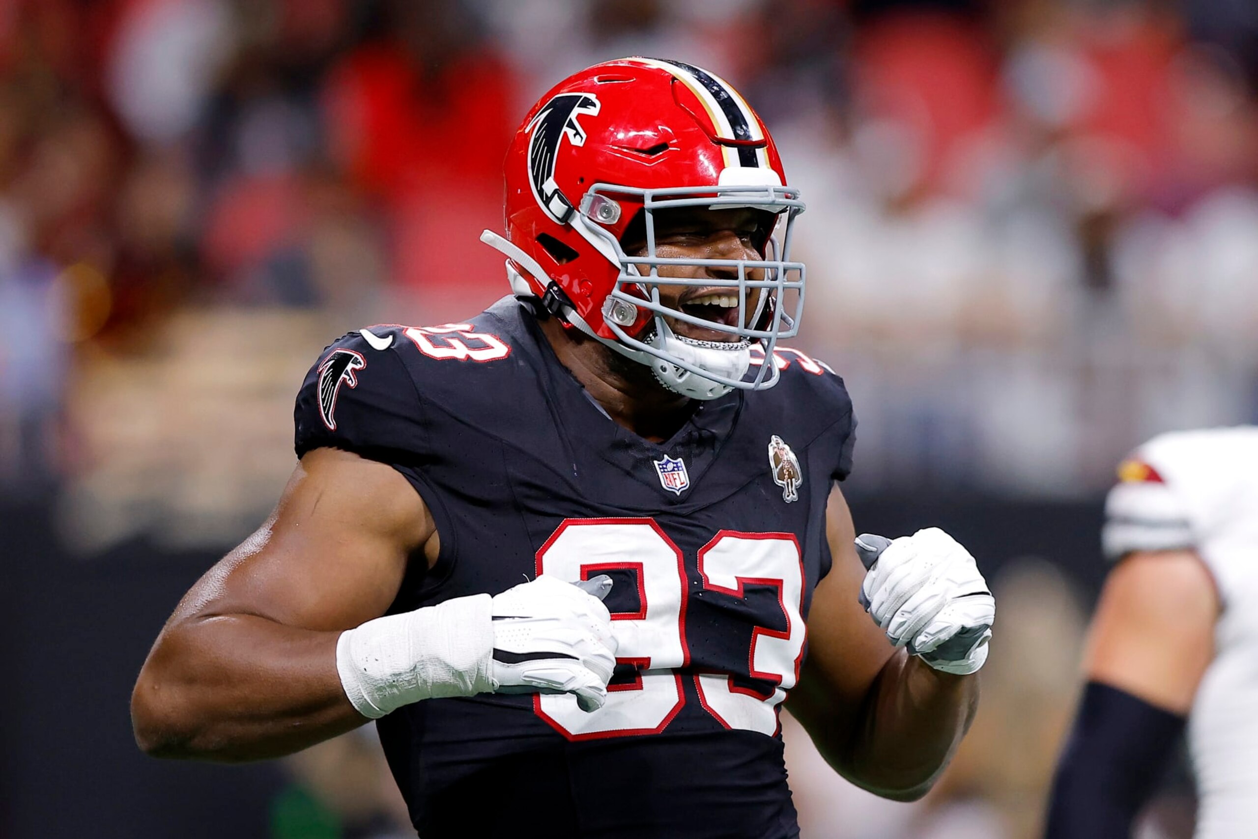 ATLANTA, GEORGIA - OCTOBER 15: Calais Campbell #93 of the Atlanta Falcons celebrates after recording his 100th career sack during the second quarter against the Washington Commanders at Mercedes-Benz Stadium on October 15, 2023 in Atlanta, Georgia. (Photo by Todd Kirkland/Getty Images)